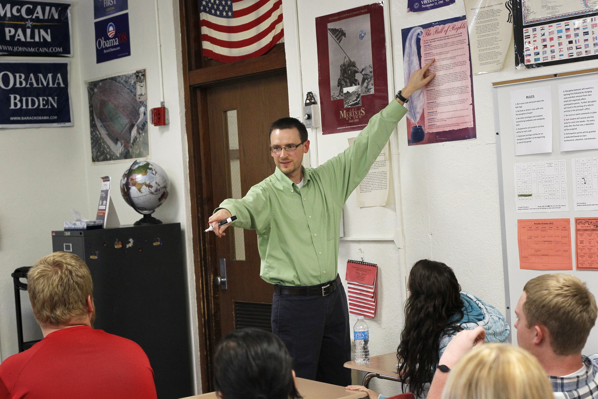  Dan Althaus goes over the Bill of Rights with his students in senior government class at Arcadia Local Schools on Oct. 16, 2012. There are several first-time voters in the class. Though Althaus doesn't usually share his political beliefs with his st