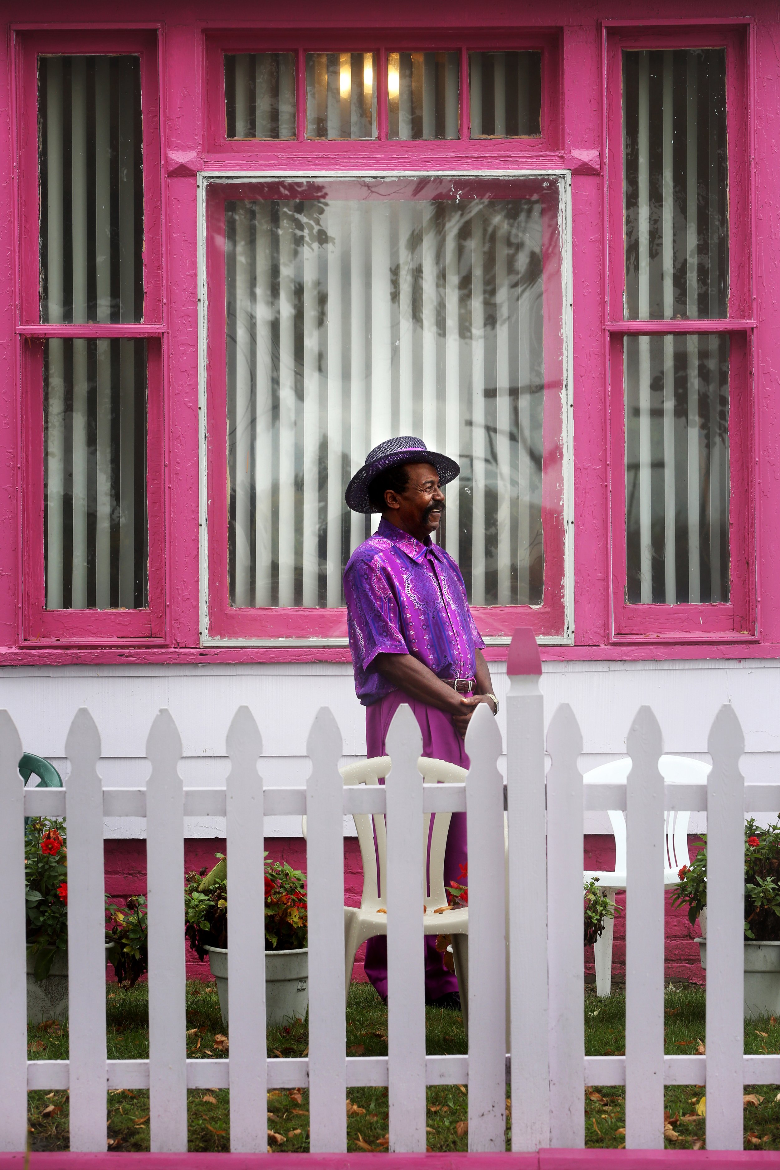  John Sutton and his wife, Mamie, decided to paint their home on Toledo's north side pale purple with a pink-maroon trim for a number of reasons. The pair, who have lived in the house for about two years, wanted to honor Ms. Sutton's sister and frien