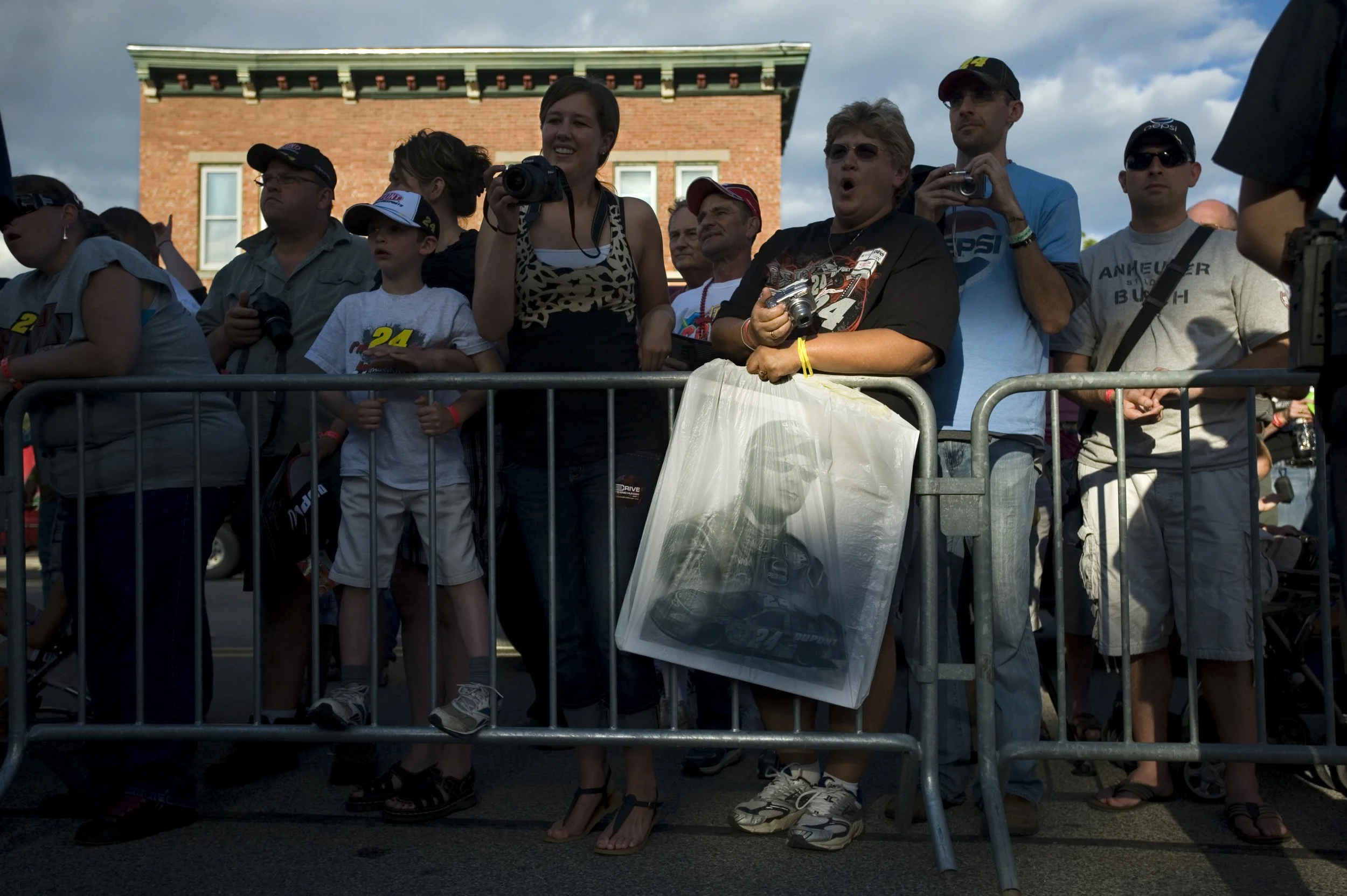  Deb Tilton, of Clinton, Mich., screams as she waited in line with her poster of NASCAR racer Jeff Gordon in downtown Brooklyn, Mich., ahead of meeting Gordon on June 16, 2012. Tilton said she had been a fan of the driver for nearly 15 years. Gordon 