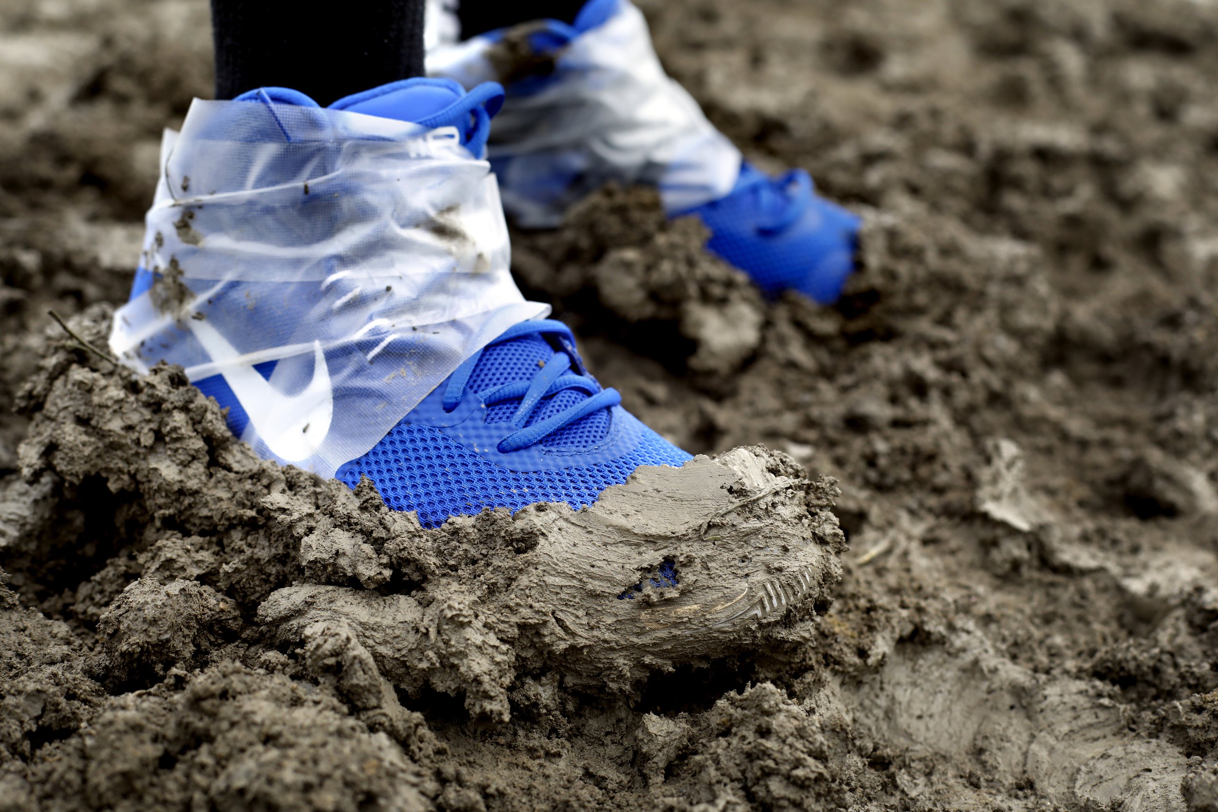  Mason Smith, 13, kept his shoes taped on in the mud during the seventh annual Mud Volleyball Tournament at the Lucas County Fairgrounds in Maumee, Ohio, on Aug. 25, 2018. The event was organized by Toledo Sport and Social Club to raise money for the