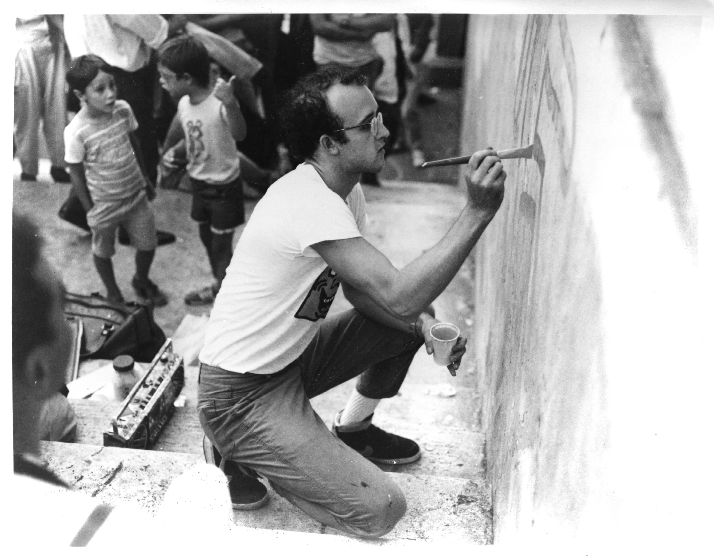Artist Keith Haring working on a mural in Philadelphia
