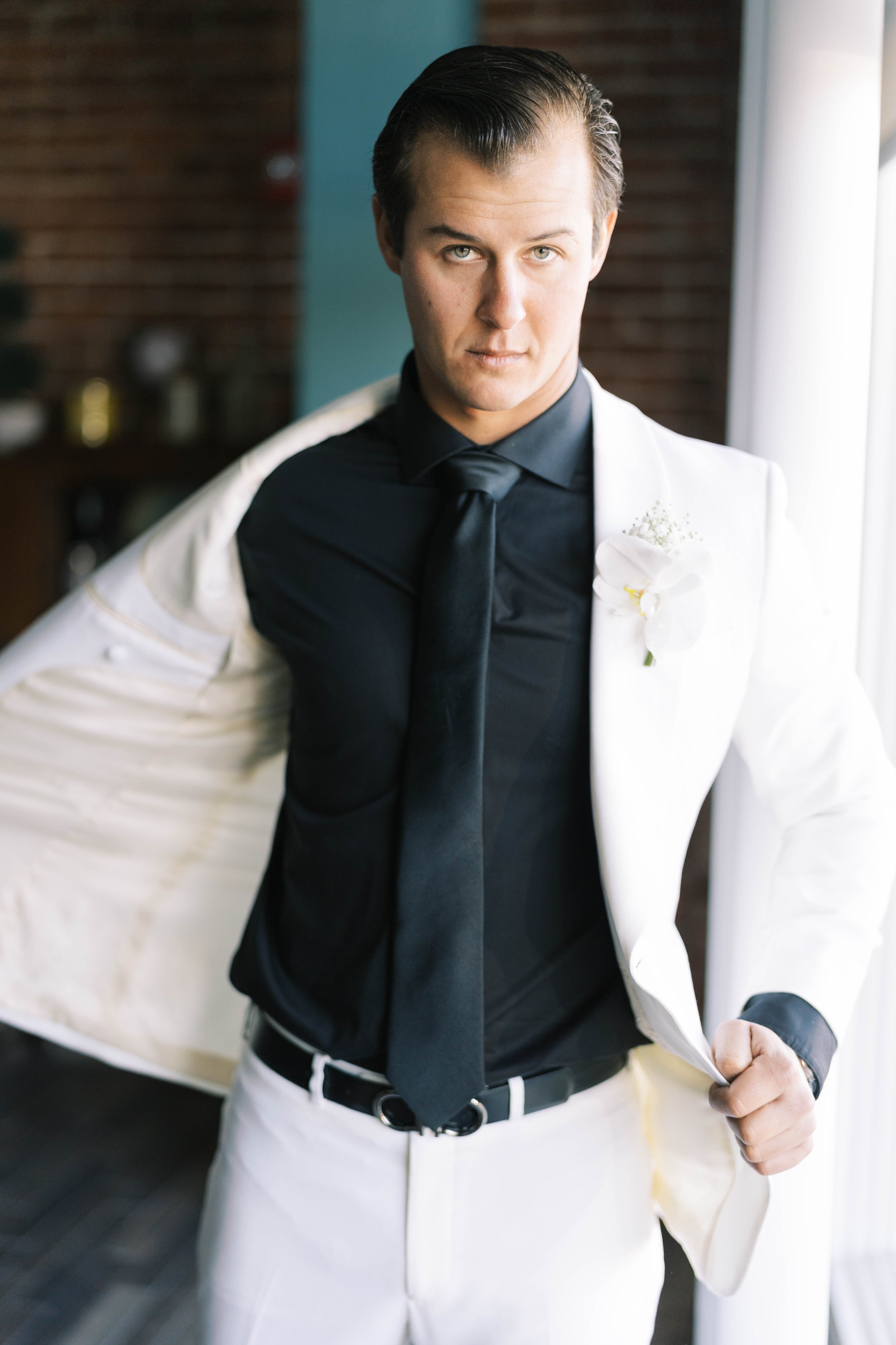 groom-portrait-white-room-florida-wedding.jpg