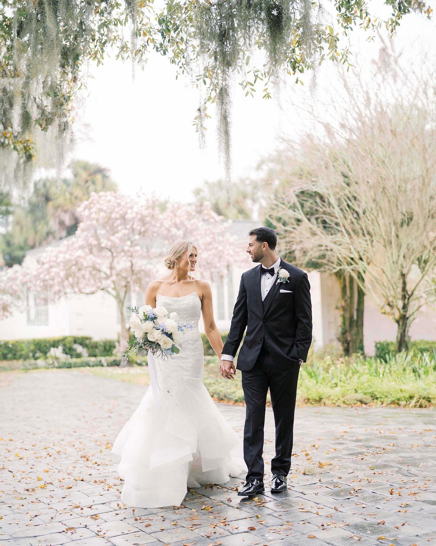 Despite one of stormiest days in February, Katie and Dom fully embraced the rain and trusted us to venture outside for some portraits. We worked quickly capturing them under the Spanish moss-draped trees at the stunning Azaleana Manor, and I'd say it