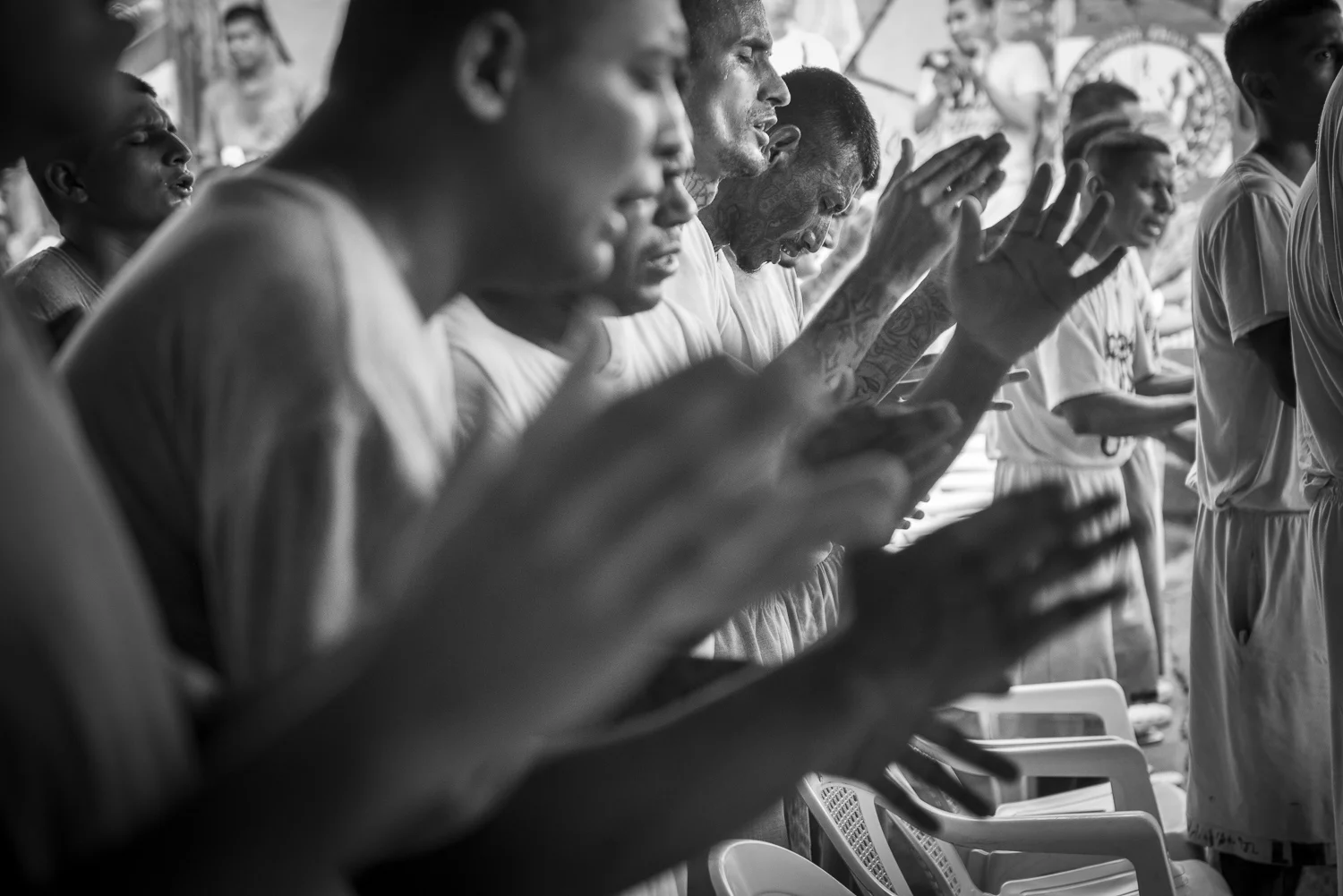 Prisoners of the yards 4, 5 and 6 of the Gotera jail participe to the worship of the Final Trumpet church. The Church was created in 2010 inside the jail. (San Francisco de Gotera, El Salvador, April 19, 2018) Credit: Nadège Mazars / Hans Lucas studio