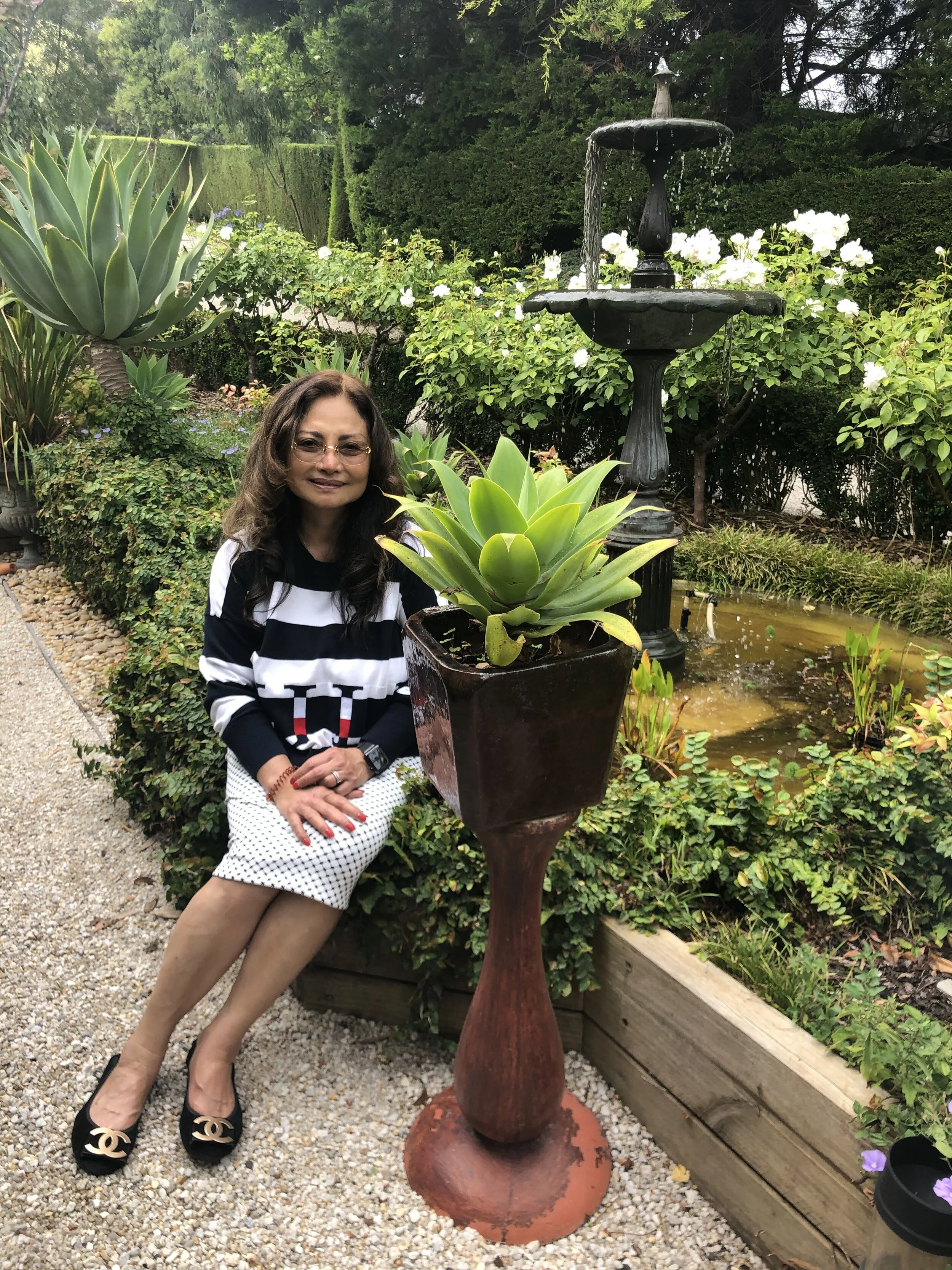 Etty Zimmerman in one of her garden’s many picture-perfect outdoor rooms.