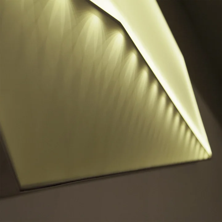  The rocket launcher pattern made by refracting light. The lamp is encased in a snug aluminum frame. 