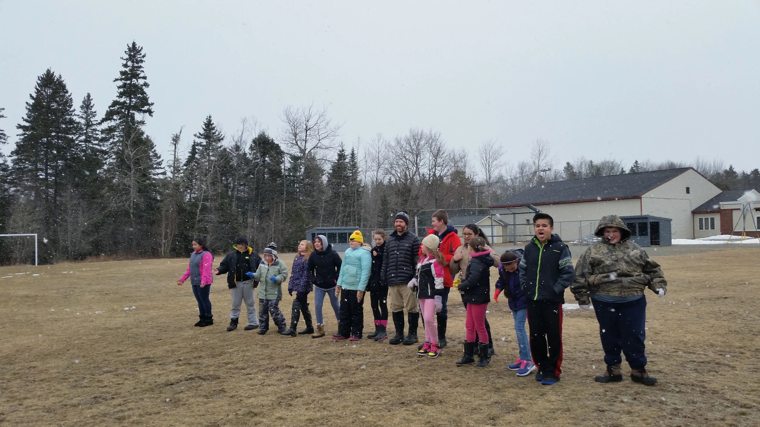 Milbridge students enjoying the snow and learning how resource availability affects populations