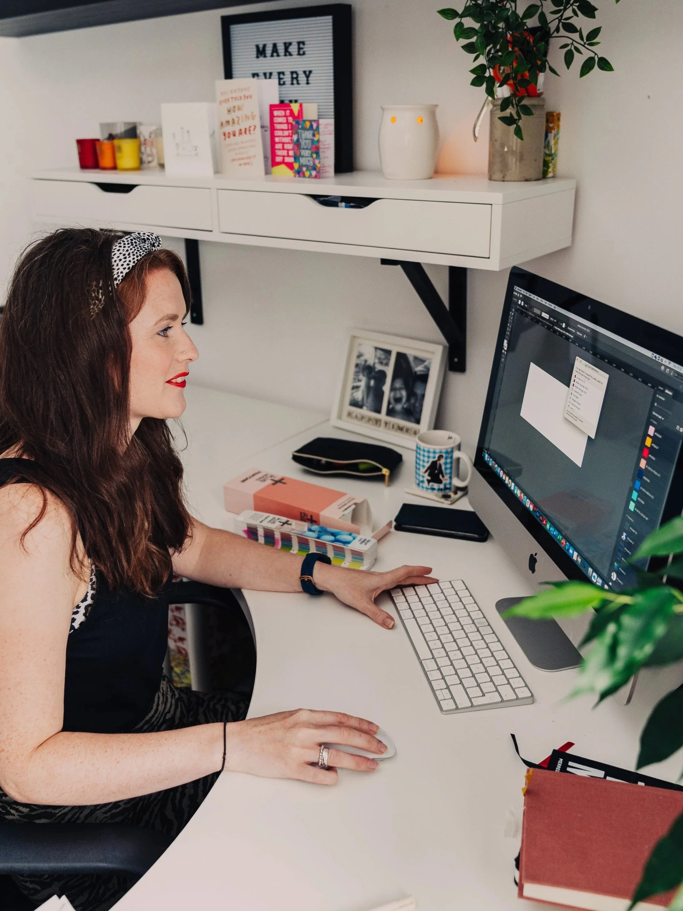 Alison Boote working on a website design at her computer