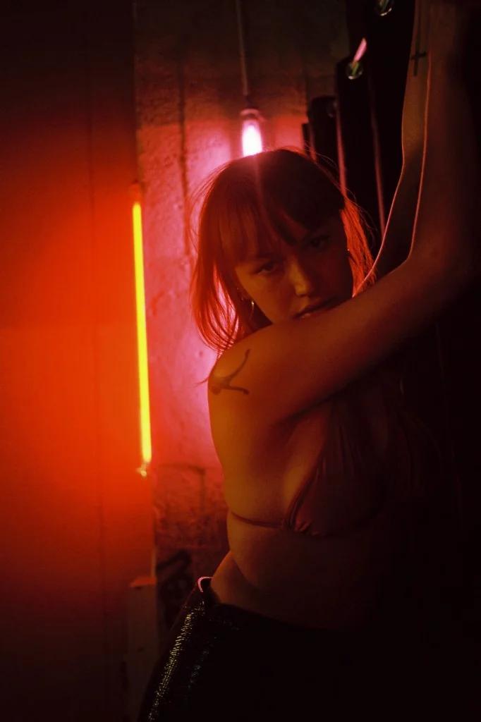  Pandora (Producer) wears AMERICAN APPAREL bra and COURRÈGES skirt. 