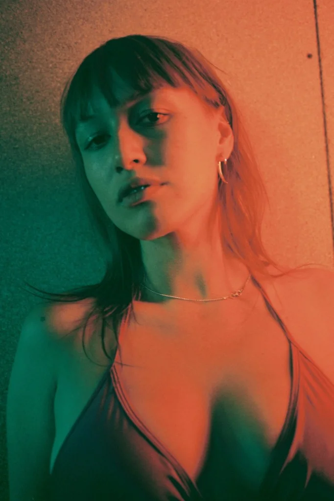  Pandora (Producer) wears AMERICAN APPAREL bra and COURRÈGES skirt. 