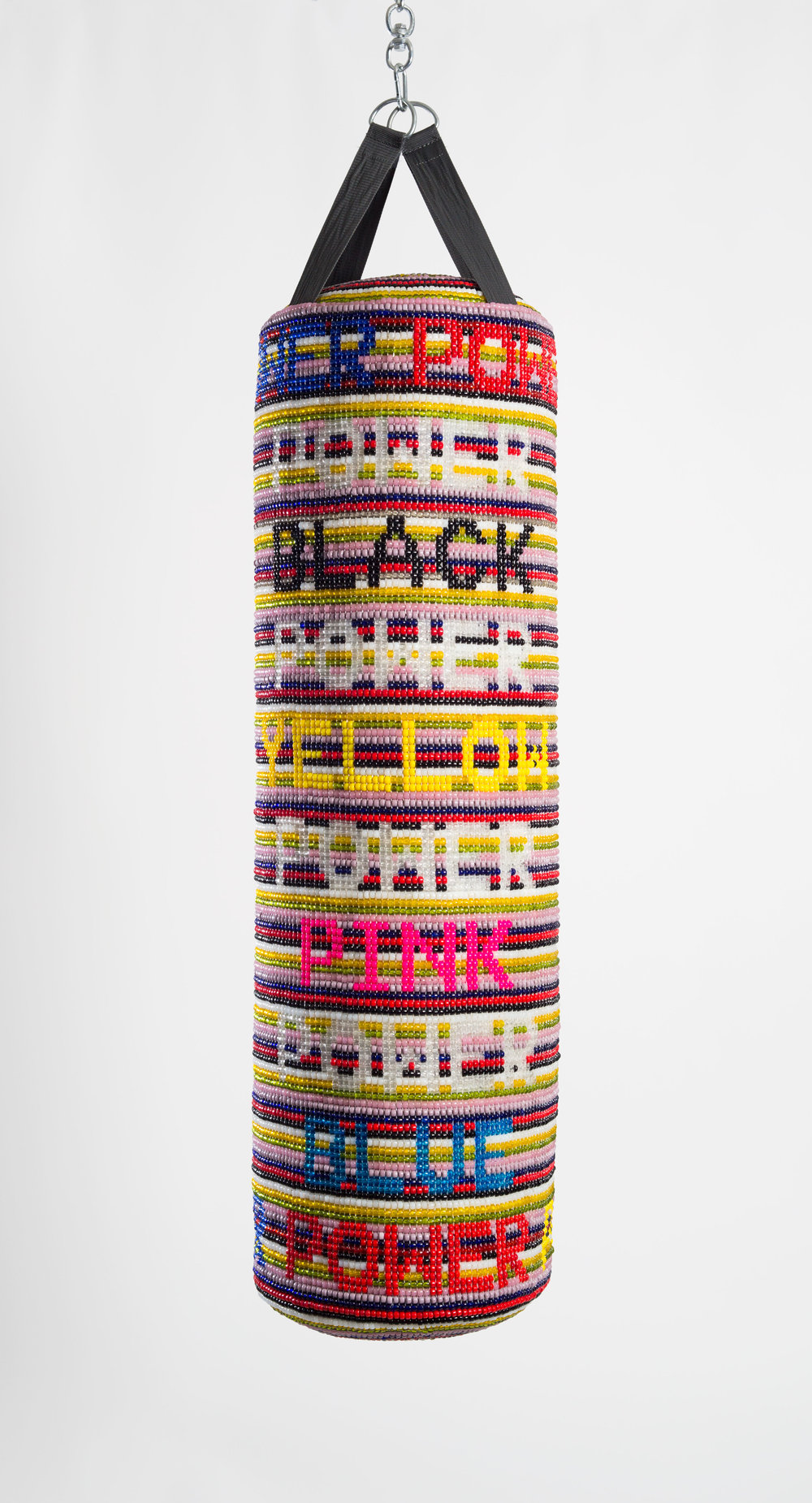 Jeffrey Gibson. “POWER POWER POWER” (2017). Repurposed vinyl punching bag, glass beads, artificial sinew, acrylic felt.51 x 12 INCHES. 