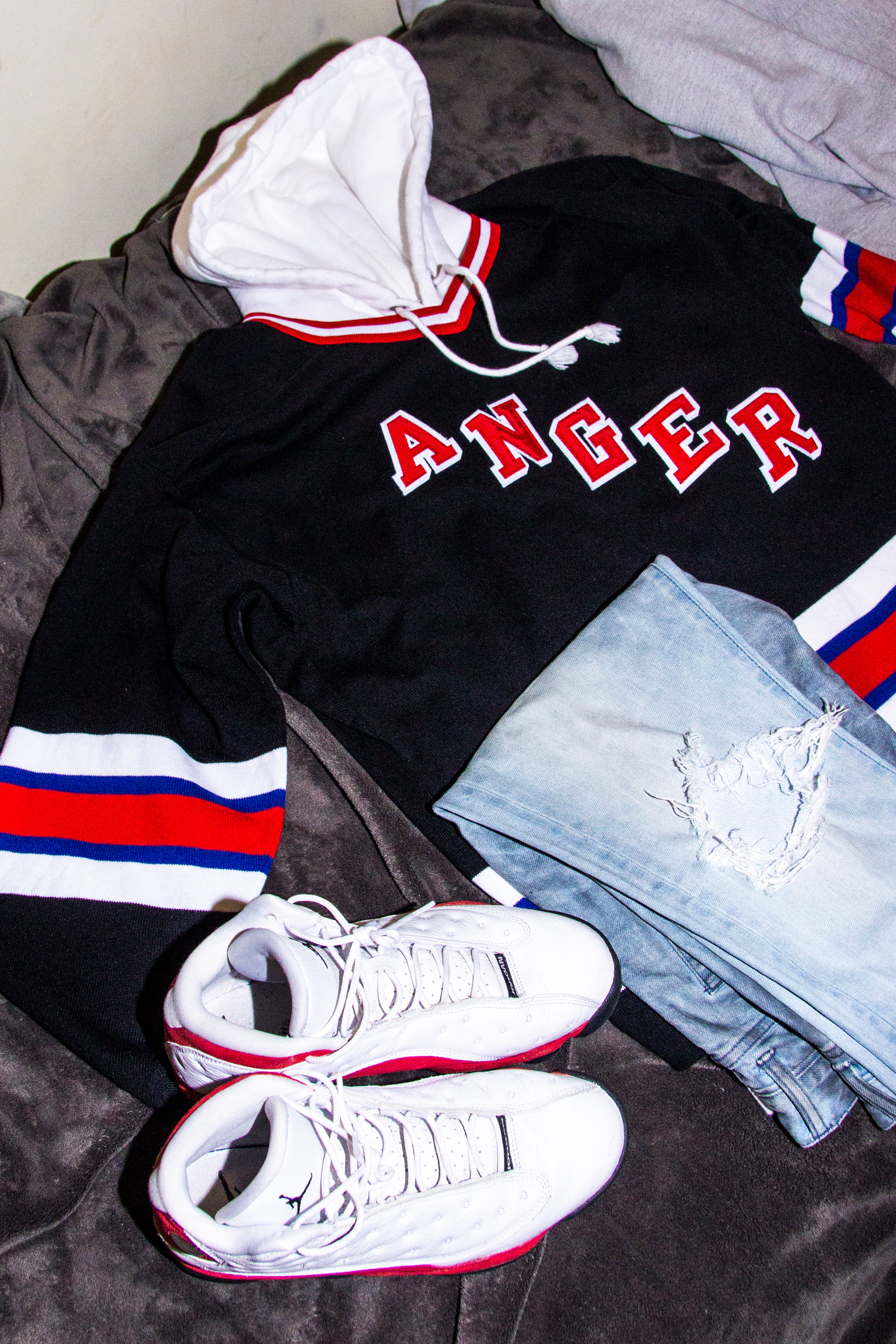 A favorite outfit of Nick's: Mr. Completely hoodie, ripped jeans, and, of course, his favorite Air Jordans.