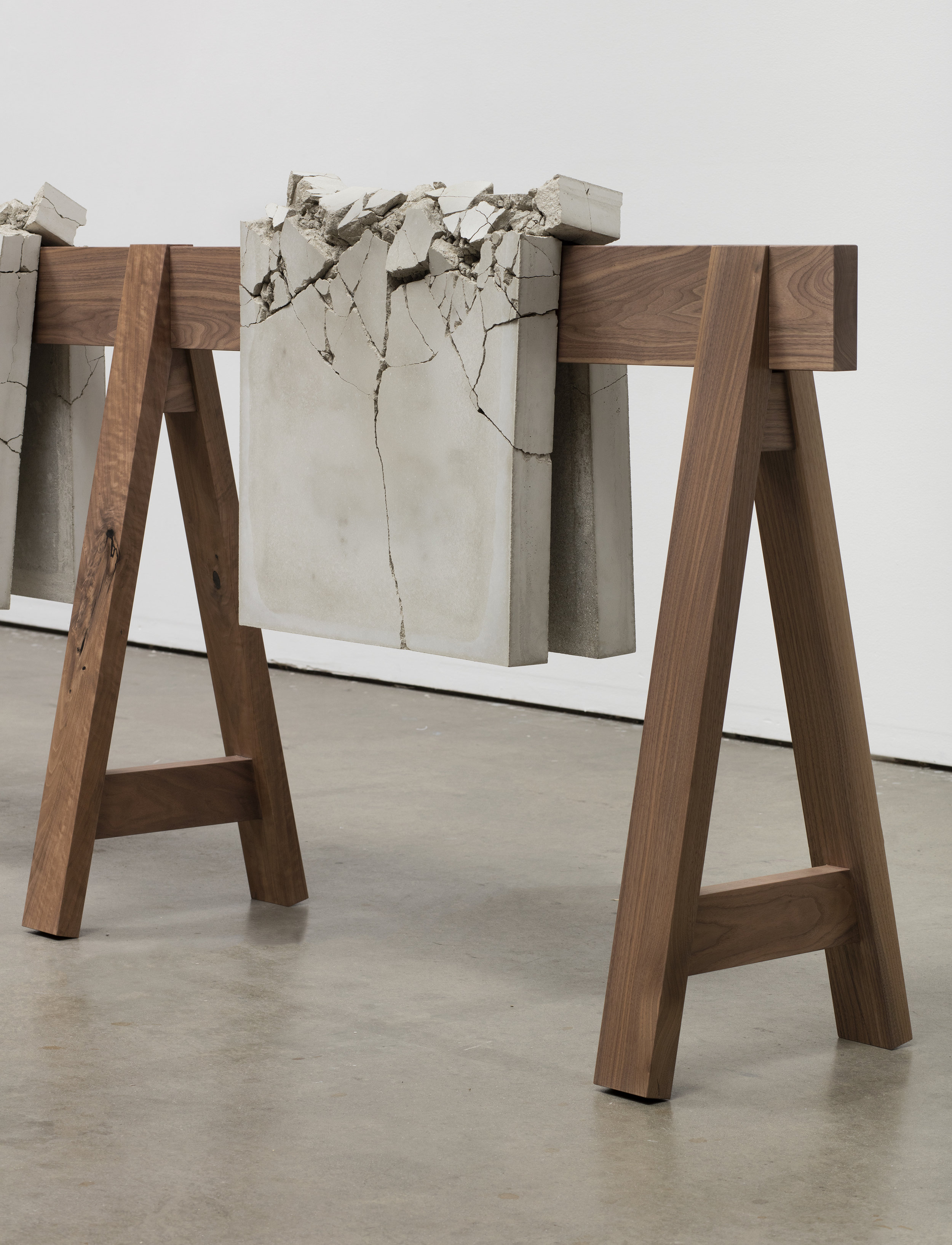 Analia Saban. “Draped Concrete” (2016). Four concrete slabs on wooden sawhorse. 104,8 x 487,7 x 42,9 41 CENTIMETERS. 1/4 x 192 x 16 7/8 INCHES Courtesy the artist and Sprüth Magers Photo: Brian Forrest