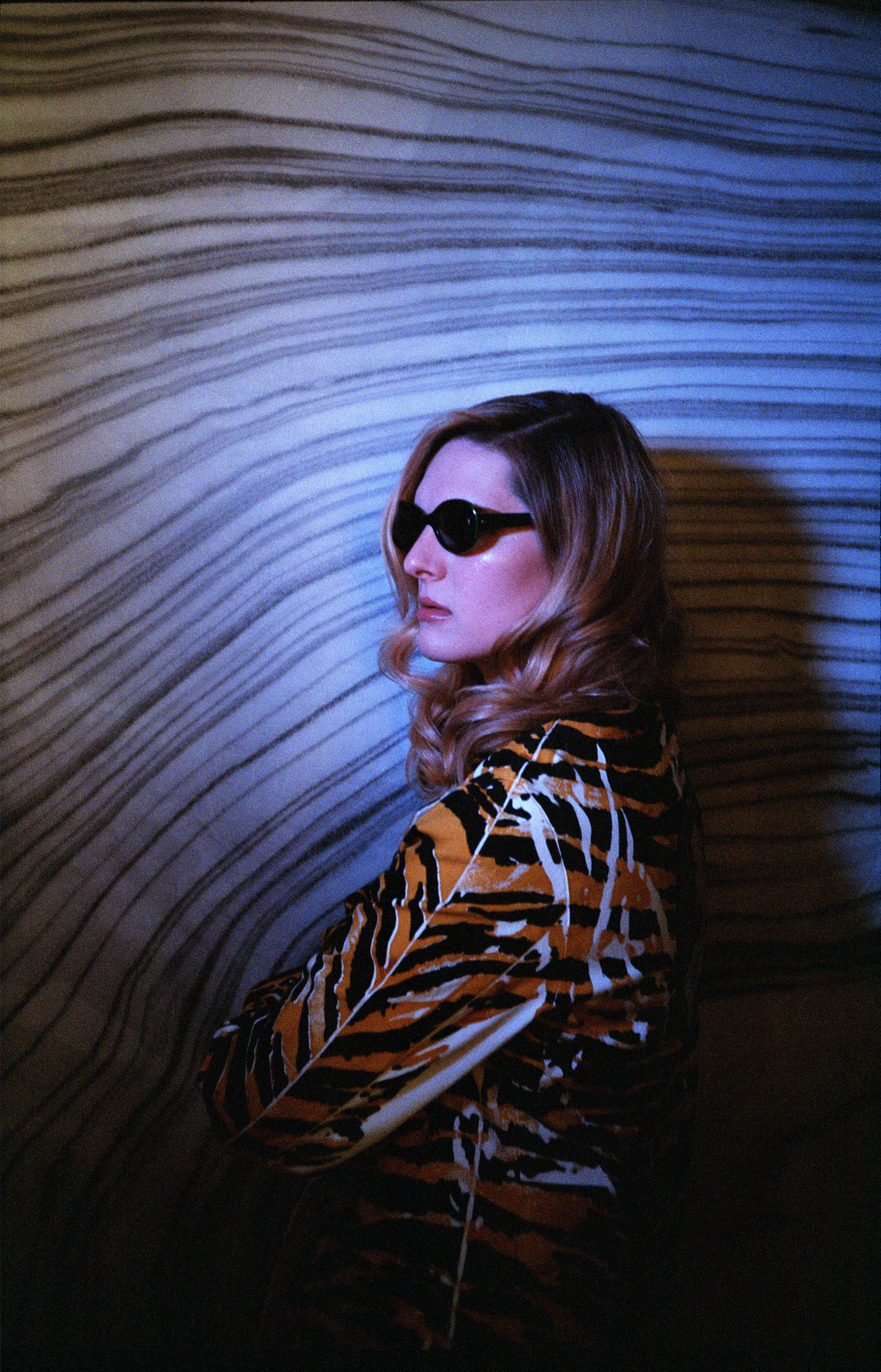 PRADA coat, LAND OF DISTRACTION dress, and CUTLER AND GROSS sunglasses.