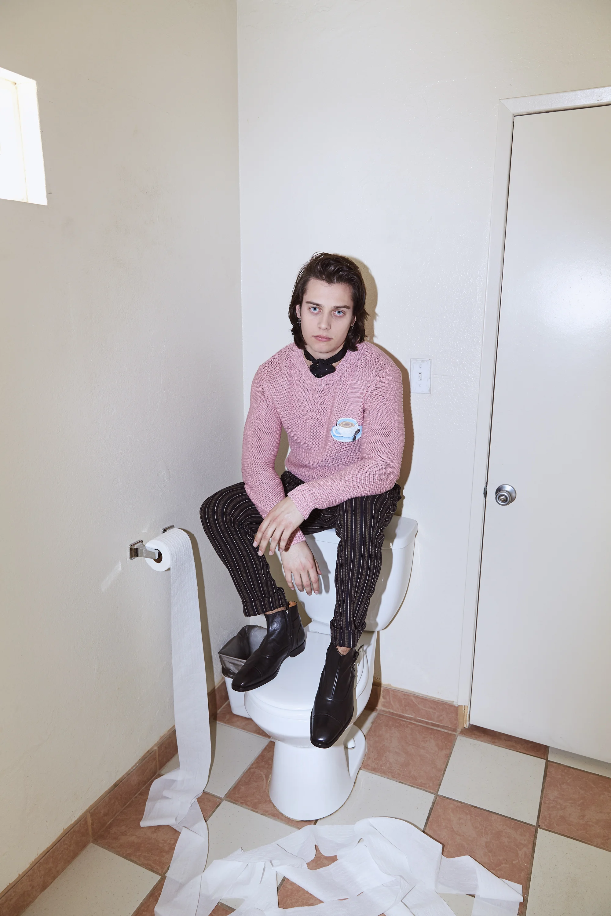 Mark wears FENDI sweater, ETRO pants, and BRUNO MAGLI shoes.