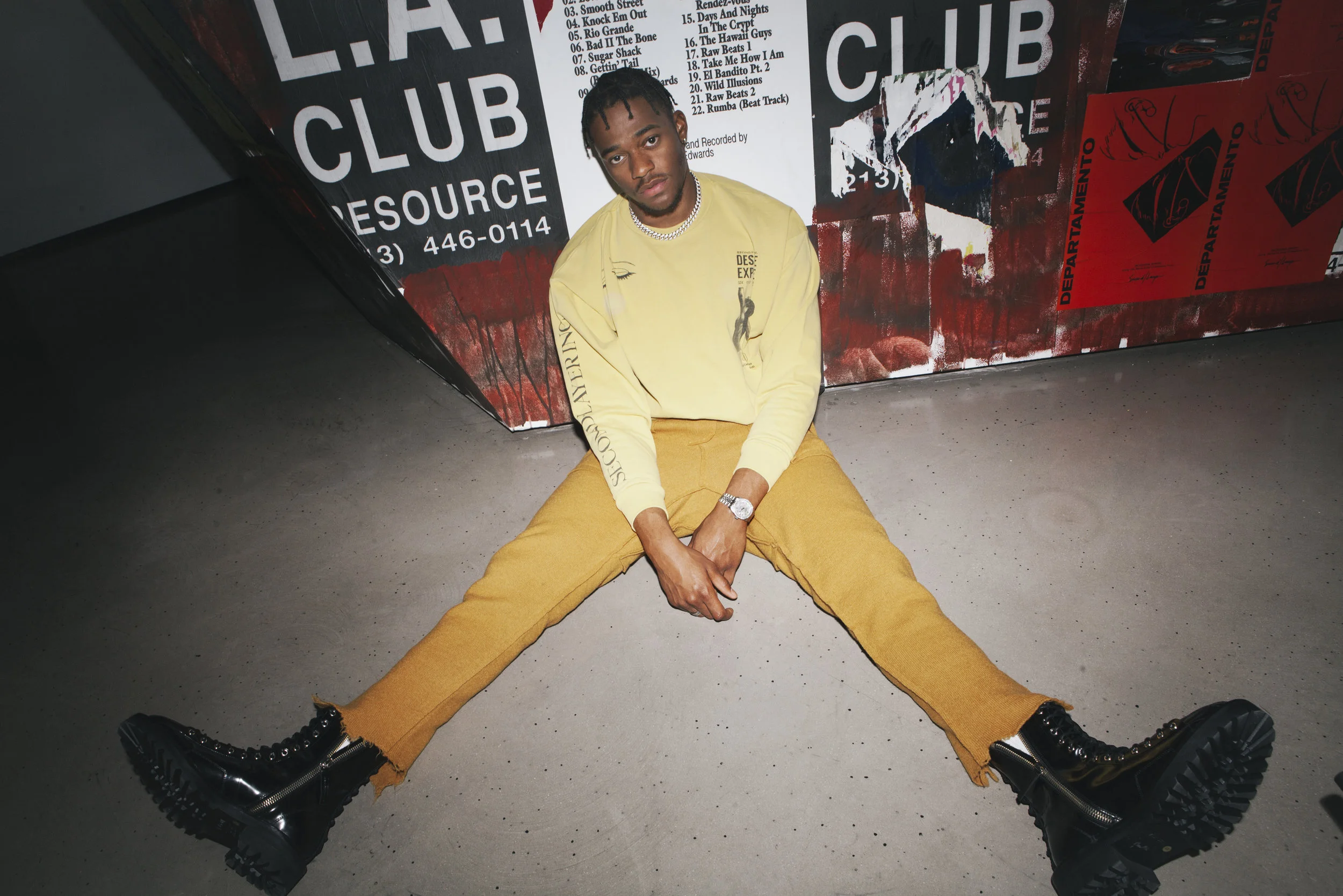 SECOND/LAYER Shirt, BED J.W. FORD Pants, and YANG LI Boots, and Talent’s own jewelry.