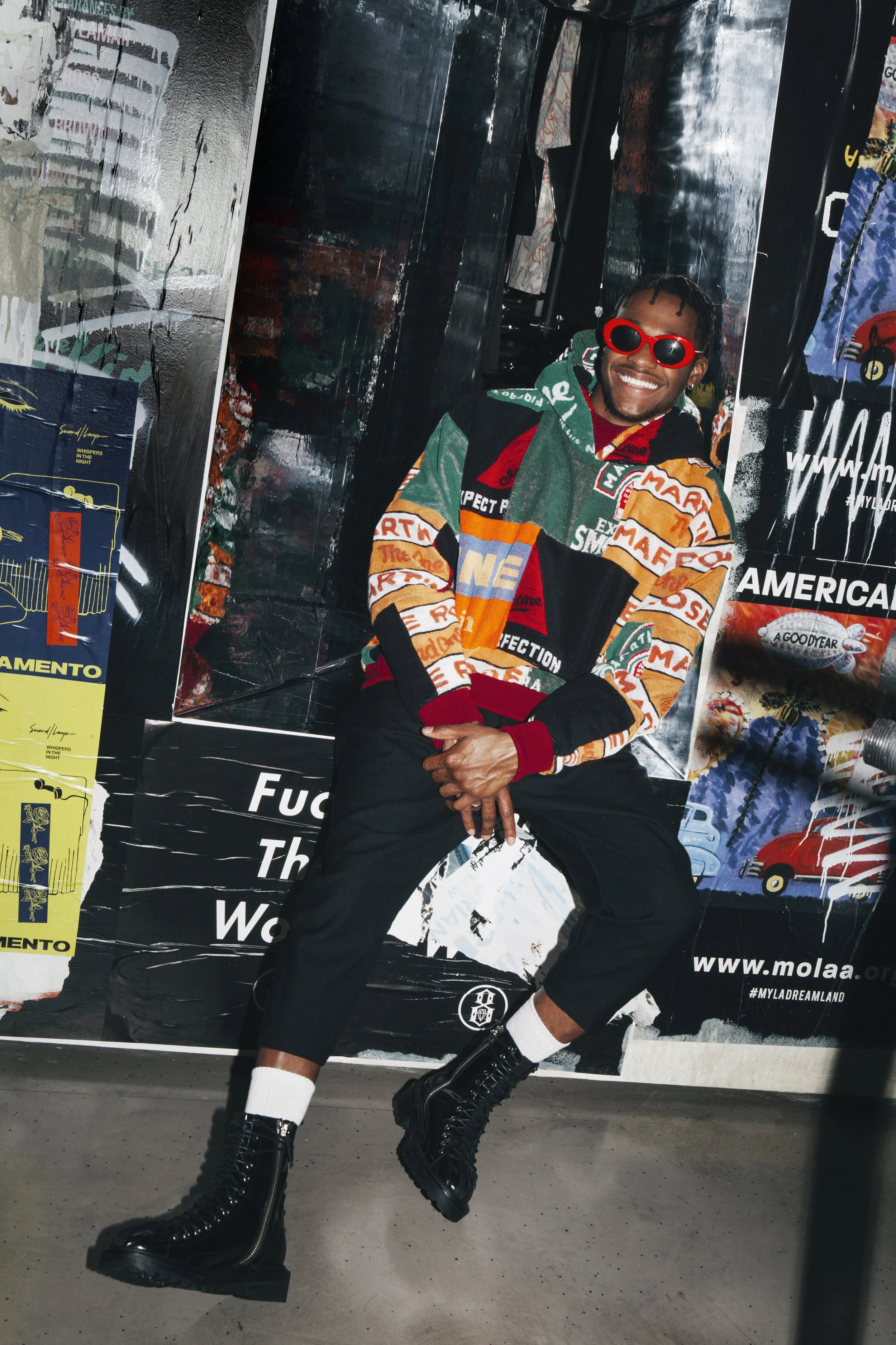 MARTIN ROSE sweater, CASEY CASEY pants, YANG LI boots, Stylist’s own glasses, and Talent’s own jewelry.