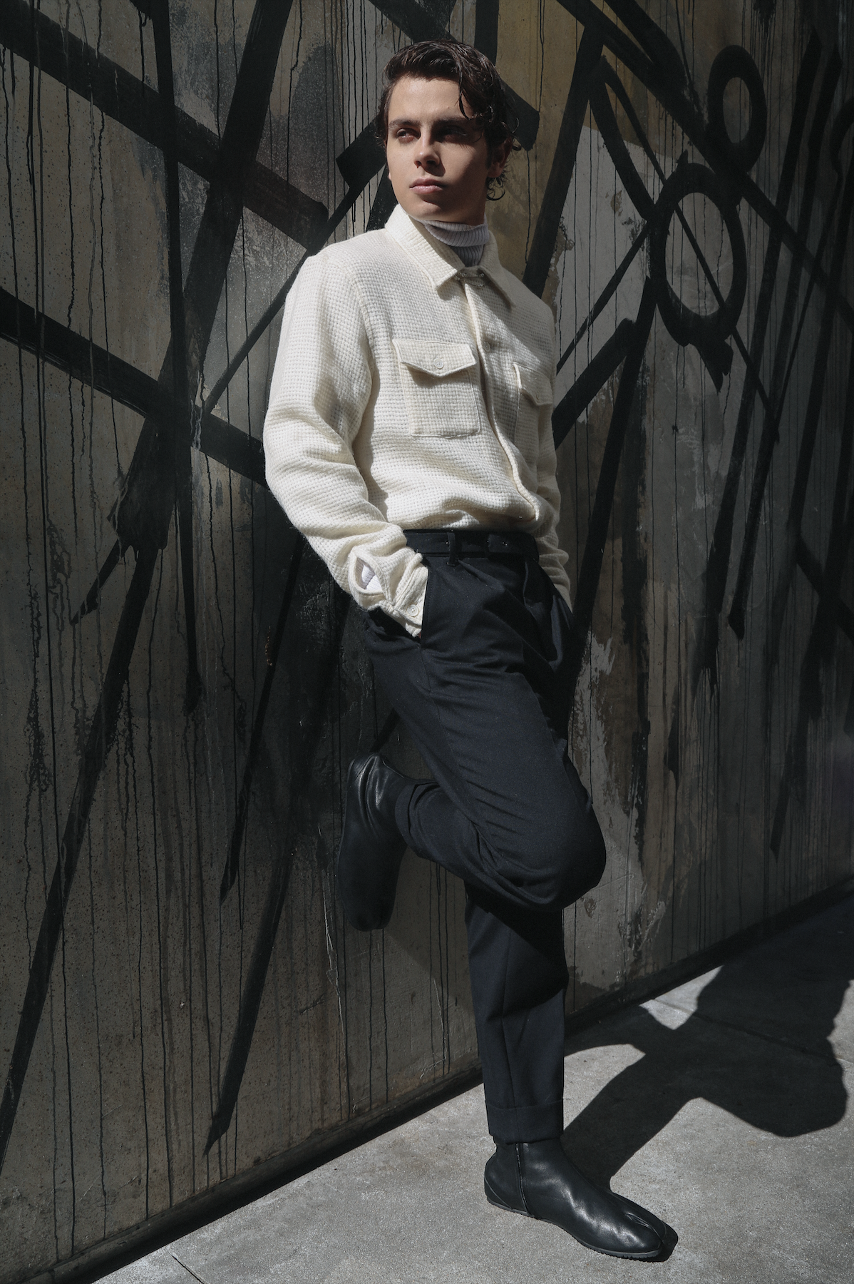 OUR LEGACY jacket, USED FUTURE turtleneck, THE KOOPLES pants, and MAISON MARGIELA shoes.