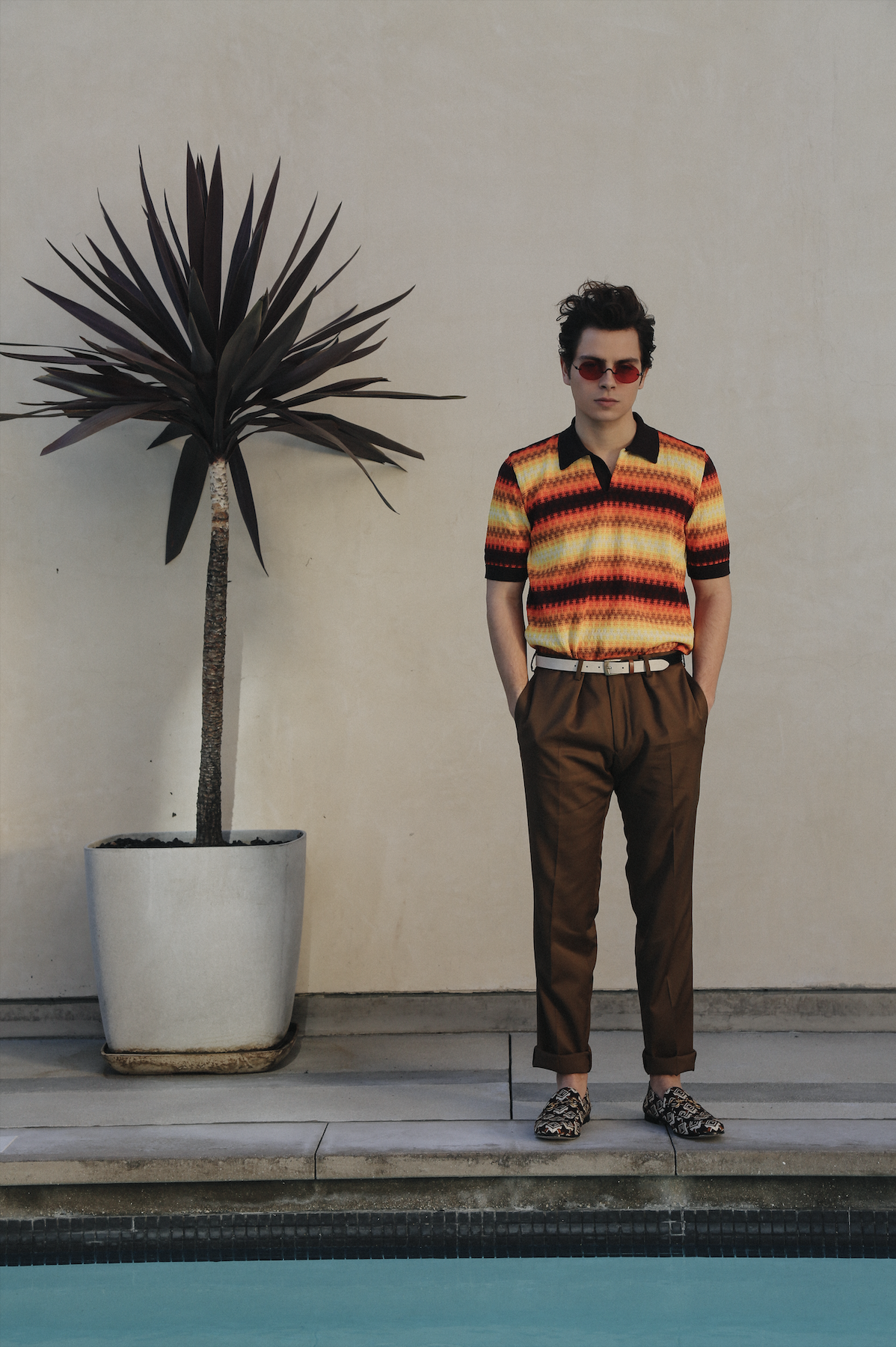DRIES VAN NOTEN shirt, THE KOOPLES pants, GUCCI shoes, URBAN OUTFITTERS belt, and stylist's own sunglasses.