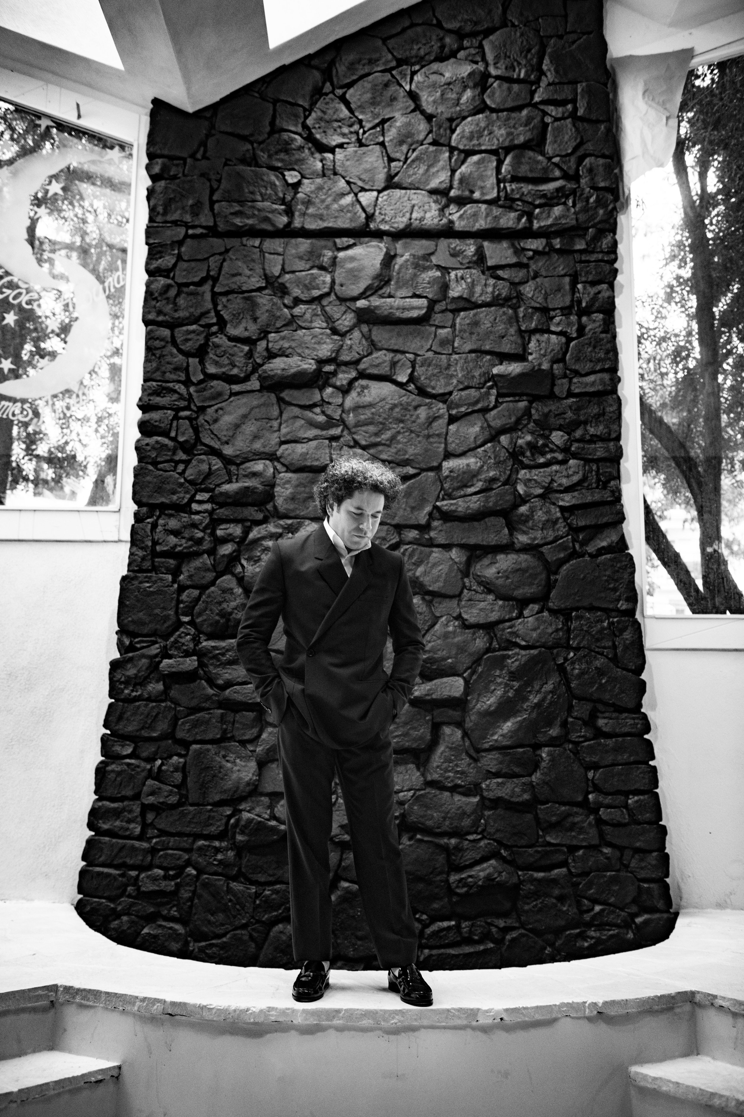 DIOR MEN suit, SCYTL shirt, and PIERRE HARDY shoes.