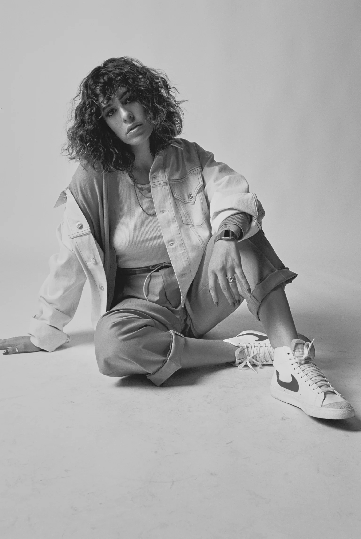 HELMUT LANG jacket, CURVE cardigan, MARTIN ASBJØRN pants, NIKE sneakers, and stylist’s own jewelry.