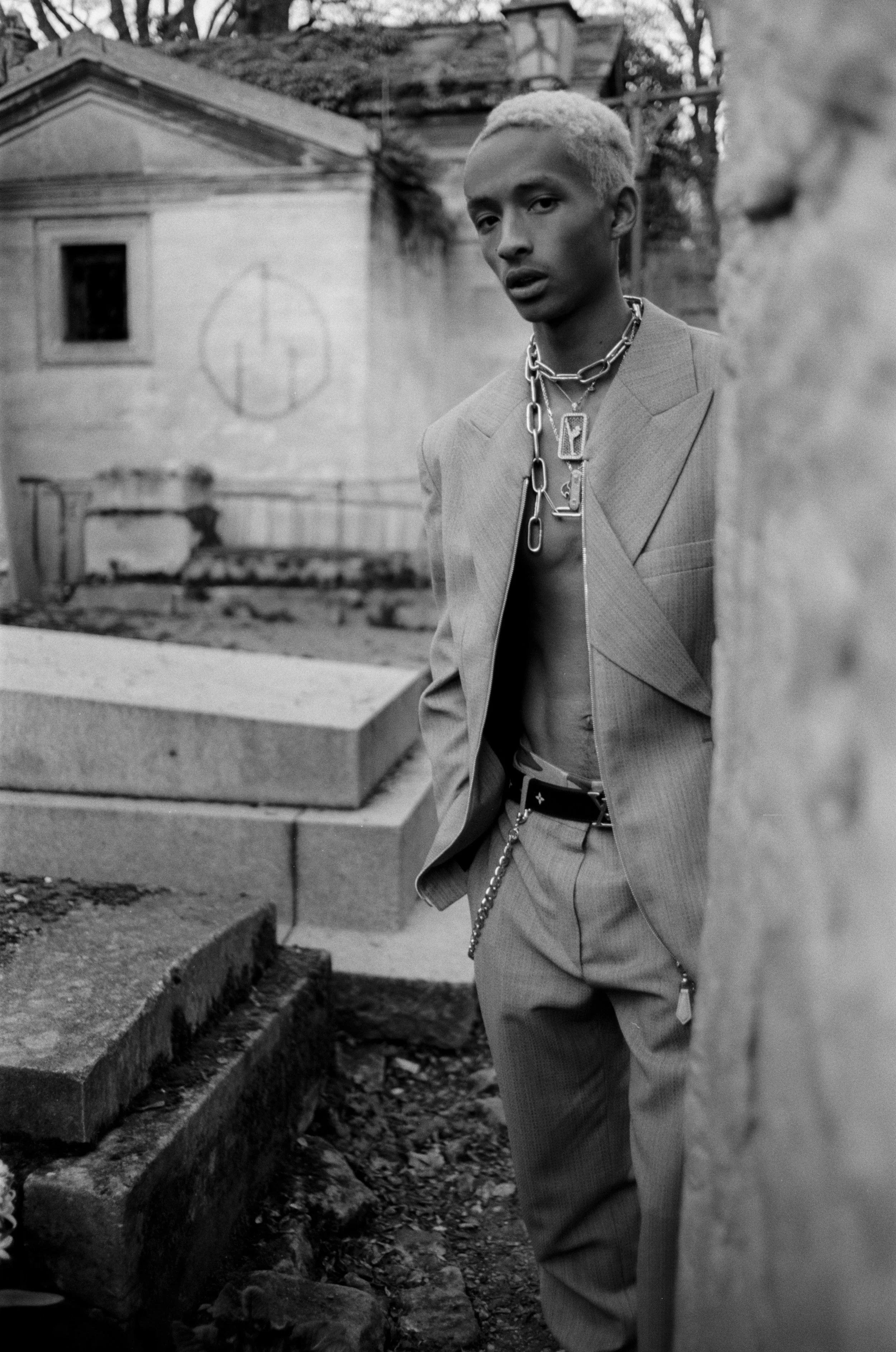 LOUIS VUITTON jacket, pants and belt and talent's own jewelry.