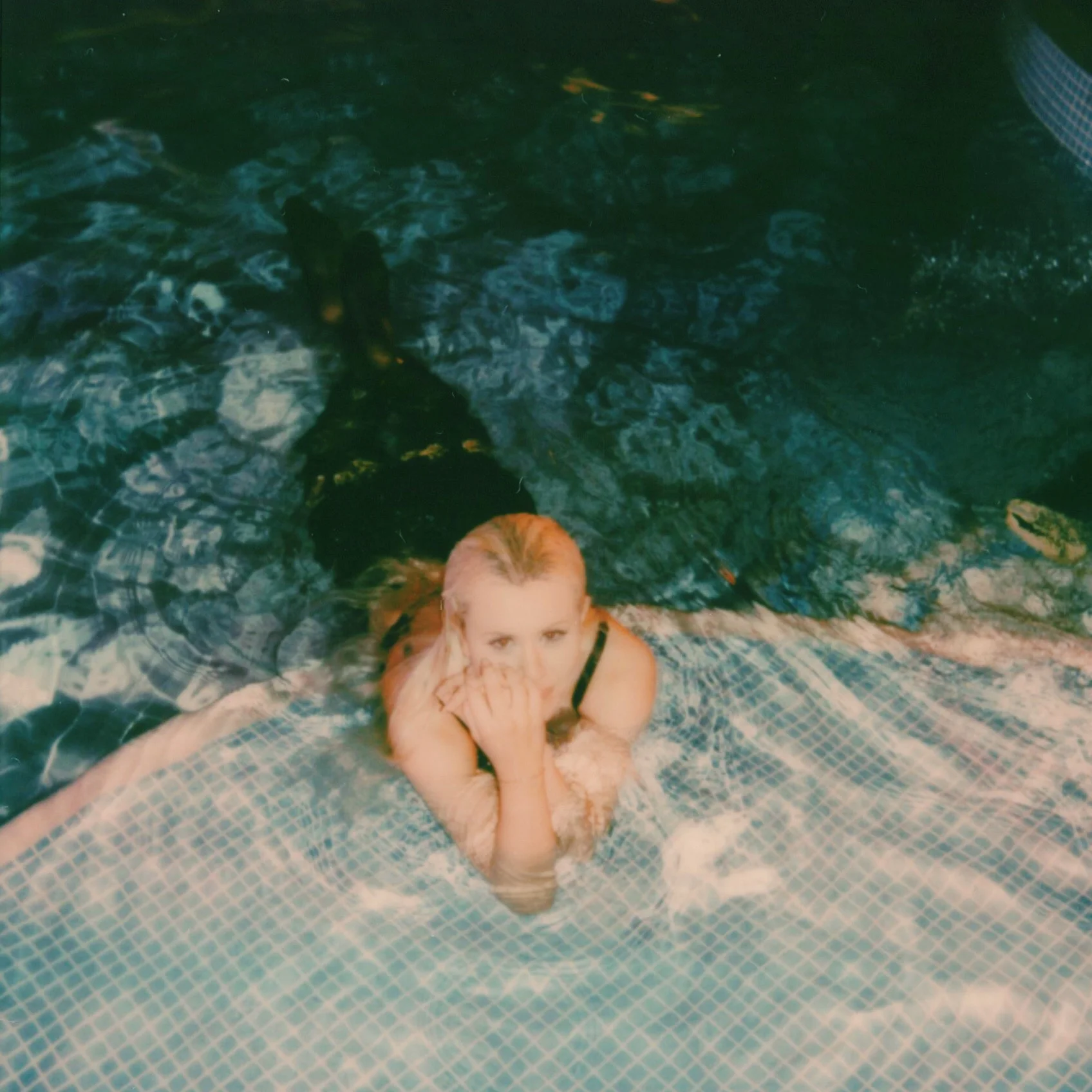 Me after jumping into the pool with my clothes on. I feel like a mermaid in this picture.
