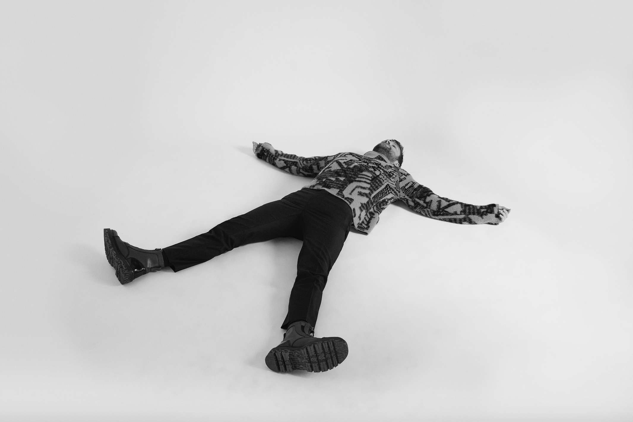 ERMENEGILDO ZEGNA sweater and boots and PRADA pants.