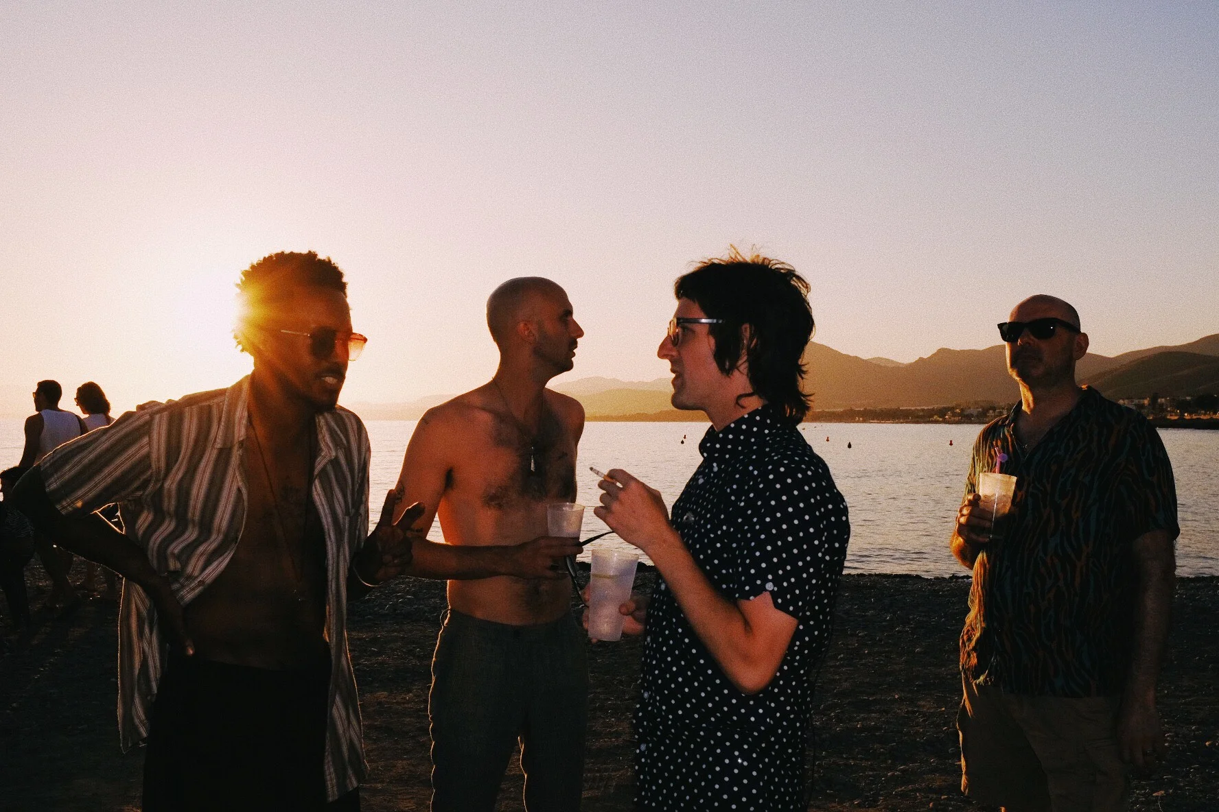 “Band (minus Travis) at sunset & my amazing tour manager Pete Smith. La Azohia, Spain.”