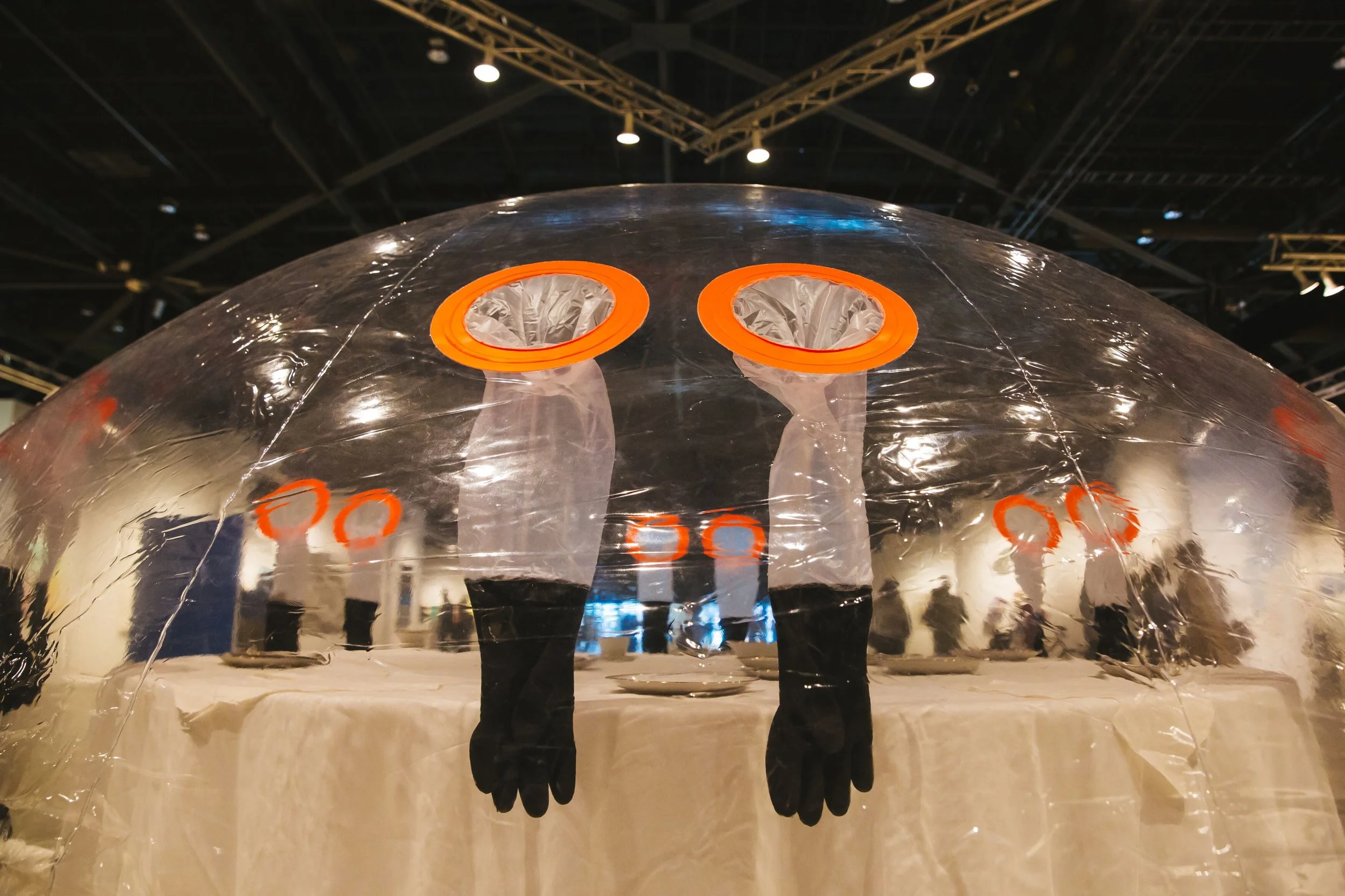 The kinetic sculpture in the shape of a doomed and domed in dinner table depicts a heavy place of the intersections of technology and the realities of earthquake eco disaster.