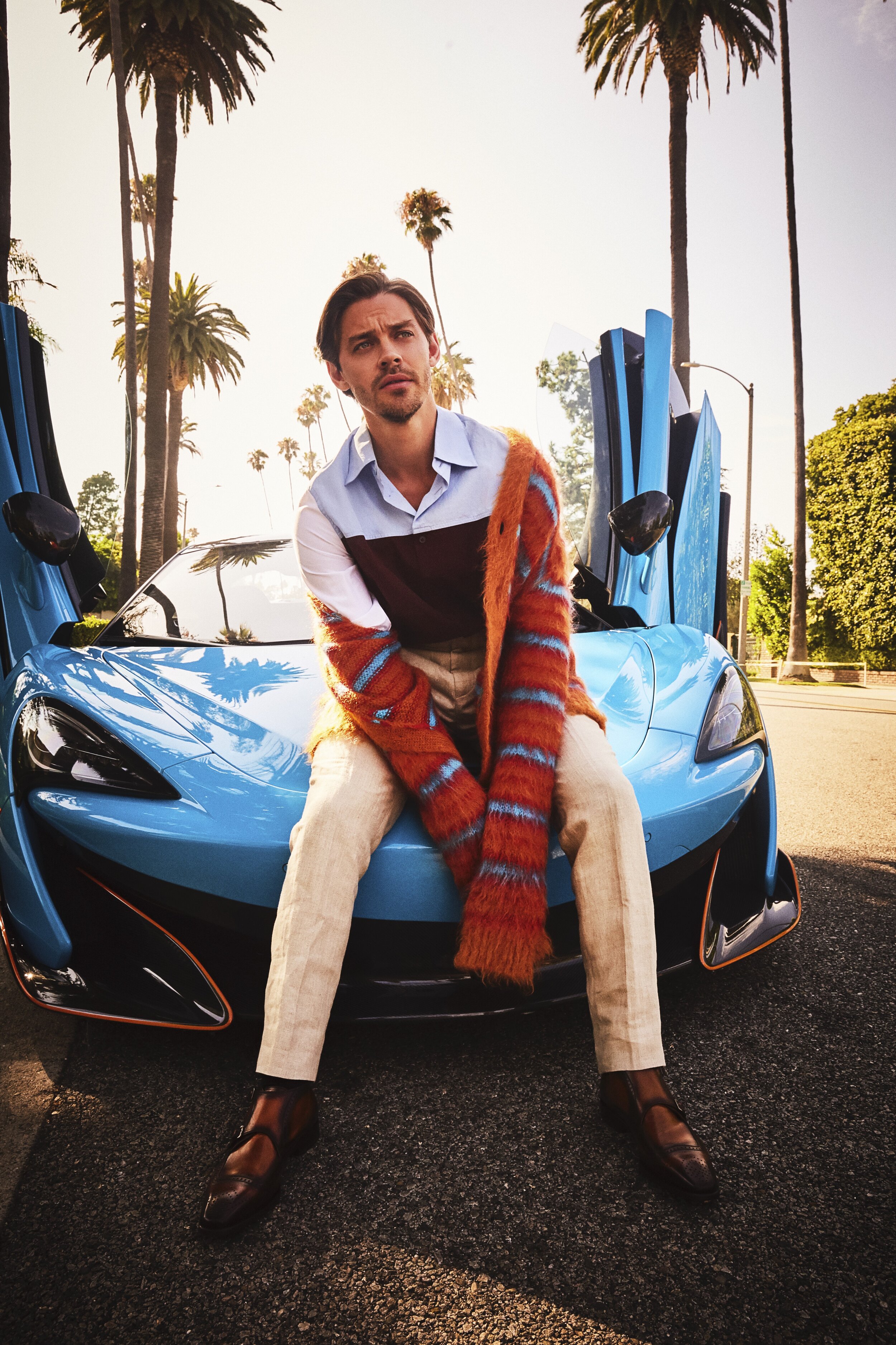 MARNI cardigan and shirt, BASIC RIGHTS pants, BRUNO MAGLI shoes. 600LT provided by McLaren Beverly Hills and O’Gara Coach.