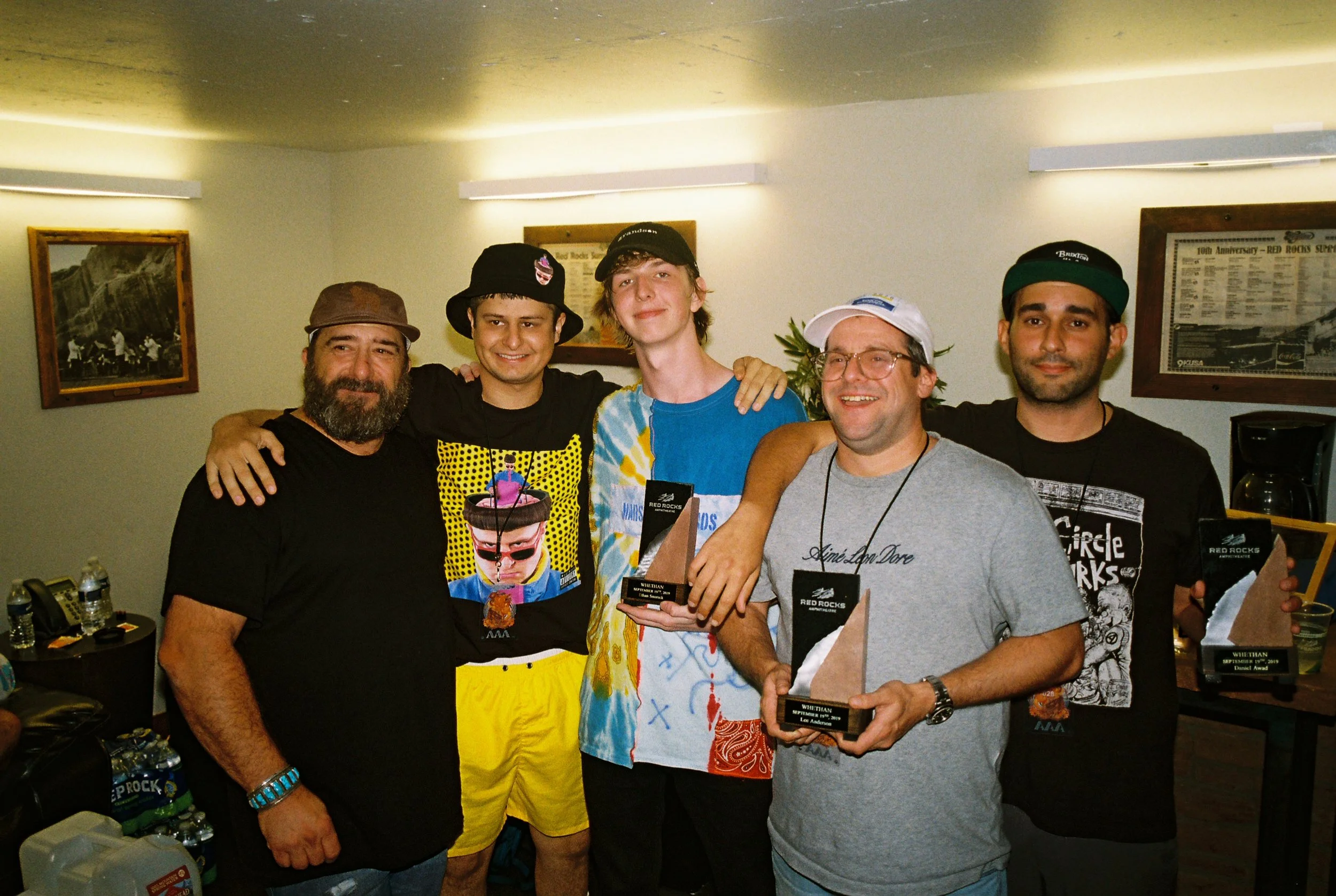 oliver tree, me, lee (agent) and dan (manager) getting a piece of the rock after selling out red rocks tradition Photo by Tak Kamihagi
