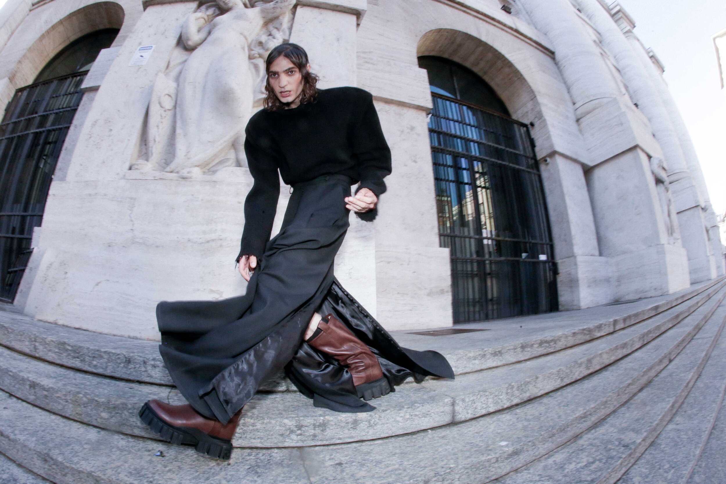VETEMENTS sweater and skirt and FENDI boots.
