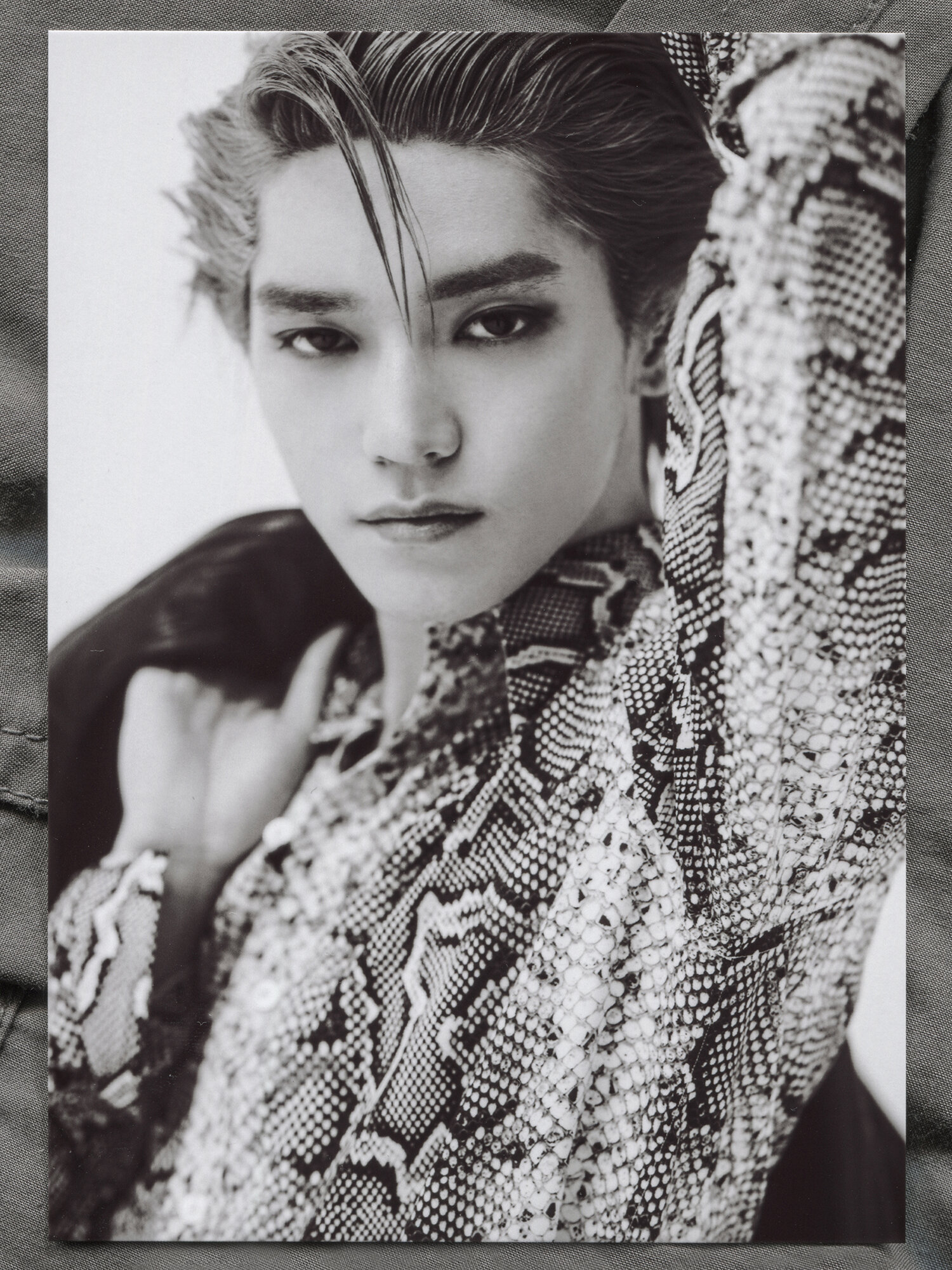 Taeyong wears TOM FORD leather jacket and shirt. GIVENCHY pants.