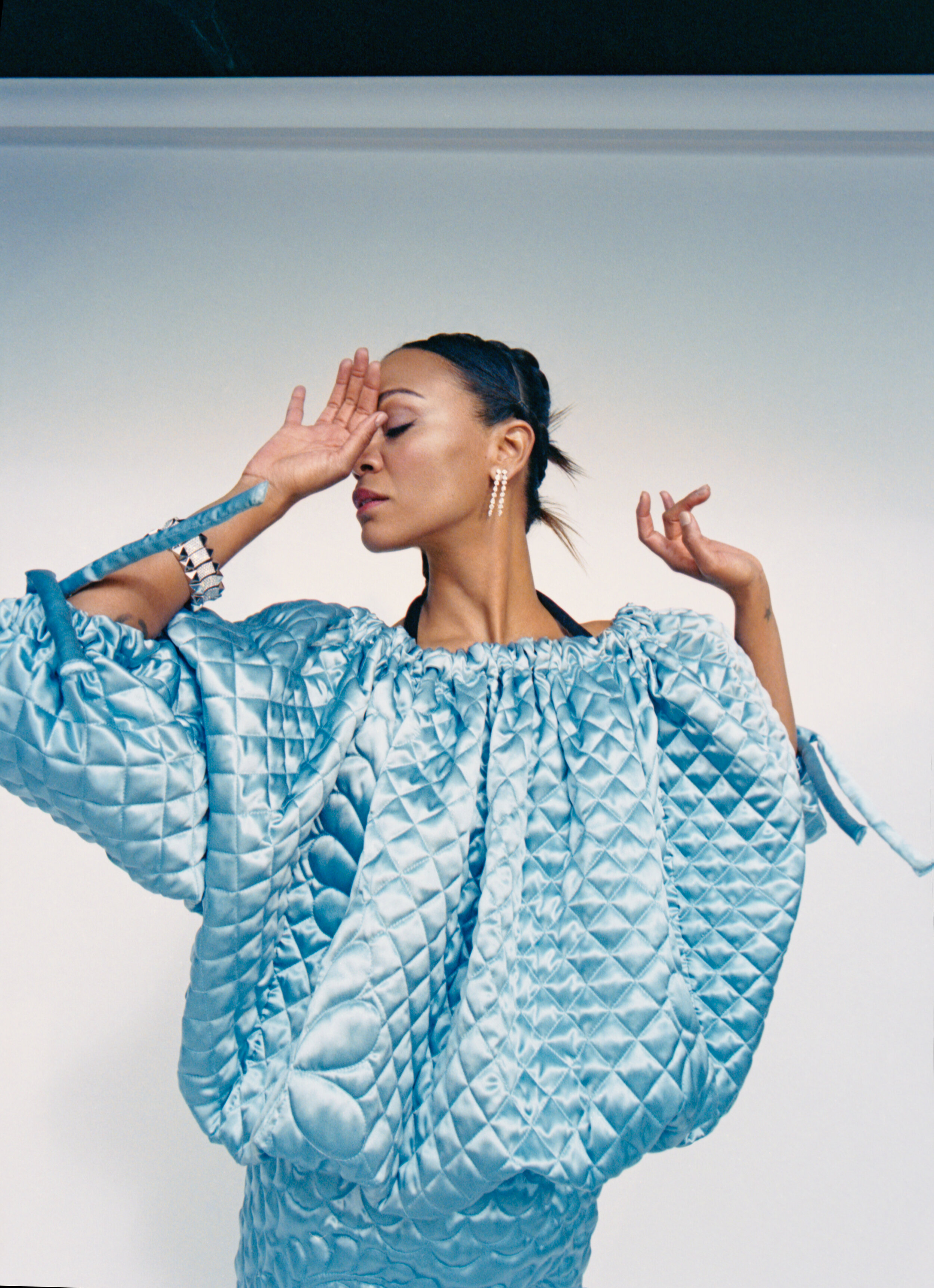 1 MONCLER JW ANDERSON dress and ROBERTO COIN earring, bracelet, and rings.