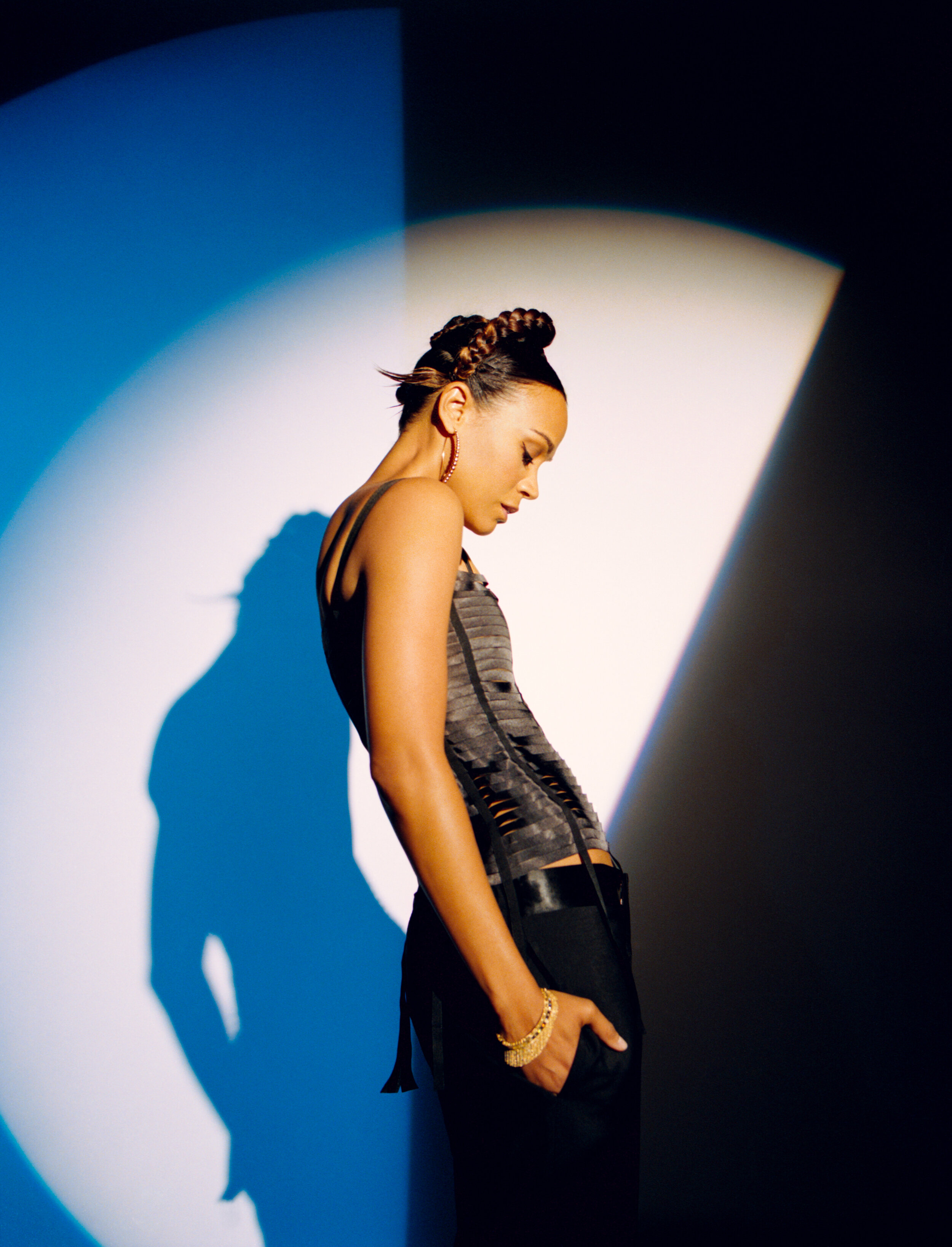 GIVENCHY top and pants and ROBERTO COIN earrings, bracelet, and rings.