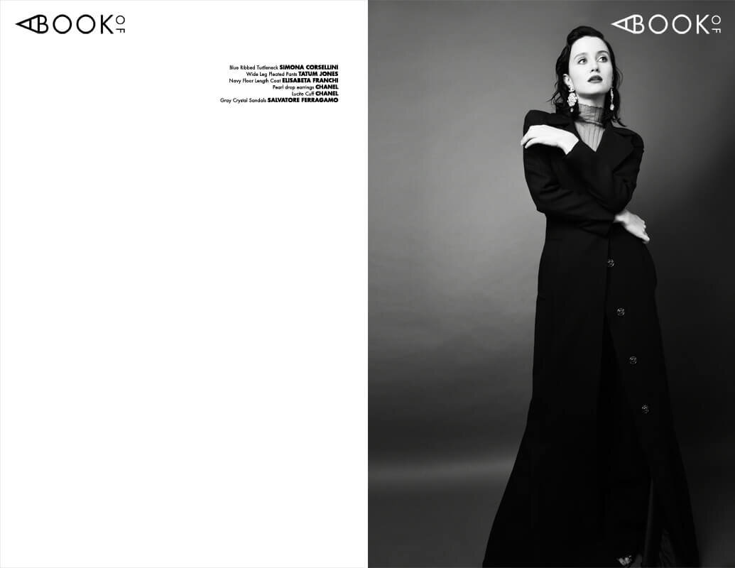Blue Ribbed Turtle Neck: SIMONA CORSELLINI, Black Wide Leg Pleated Pants: TATUM JONES, Navy Floor Length Coat: ELISABETTA FRAANCHI, Pearl Drop Earrings, CHANEL, Lucite Cuff, CHANEL, Gray Crystal Sandals: SALVATORE FERRAGAMO