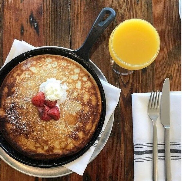 Wood Fired Pancake. ⁠
⁠
Our pancakes are cooked in our wood fired oven and then topped with your choice of toppings. This one is topped with seasonal roasted fruits and house made whipped cream. ⁠
⁠
#pancakes #mimosa #brunch