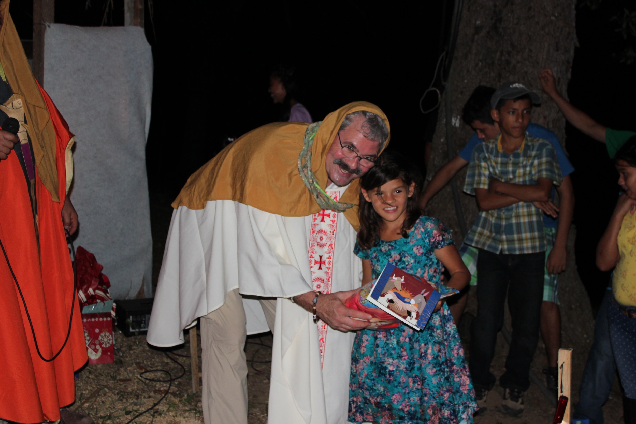 Receiving a present from one of the "Three Kings" on Three Kings Day