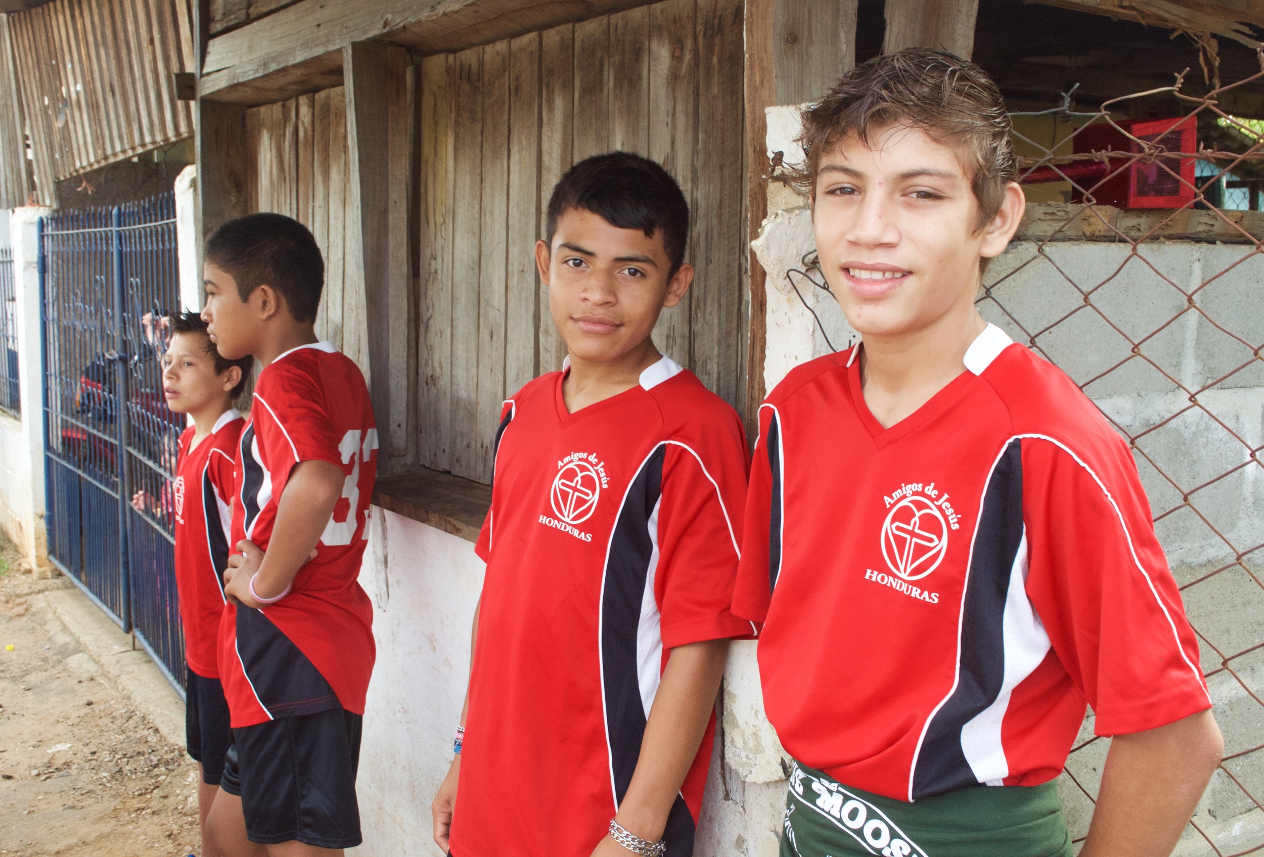 Andres (second from right) and friends pose at a soccer game.