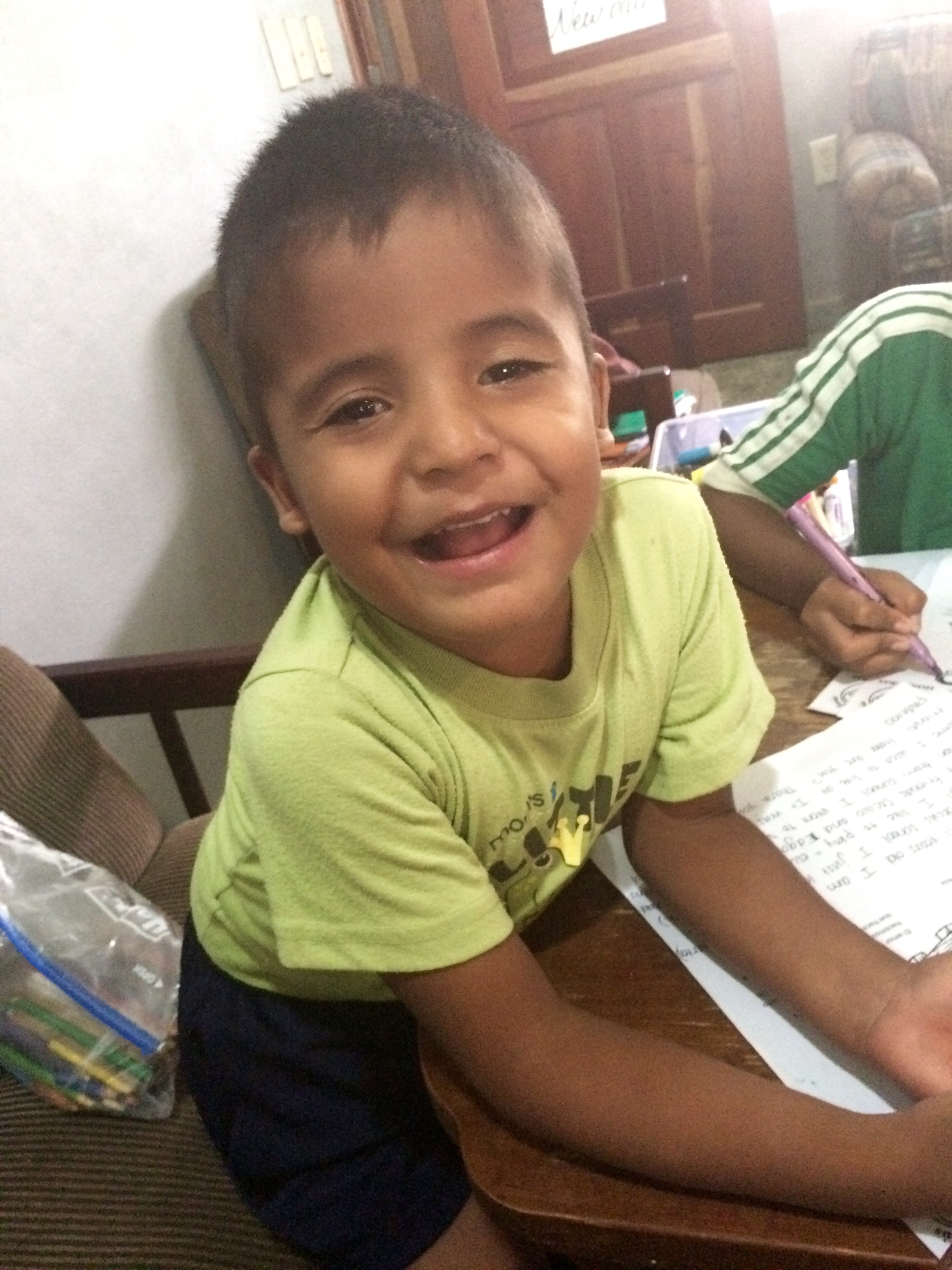 Isaac while writing letters to his sponsors in the U.S.