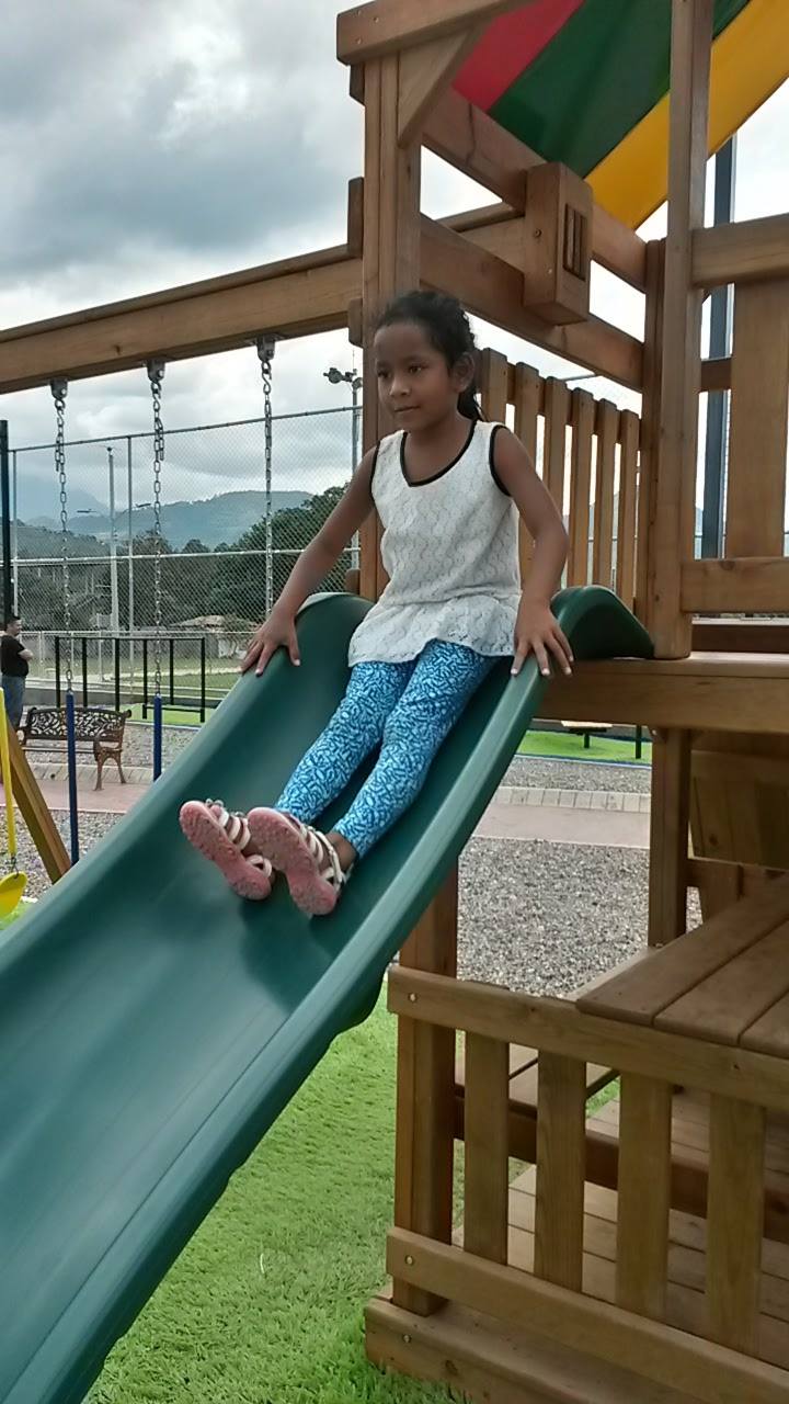 Kira trying out a fancy playground during her vacation trip in October.