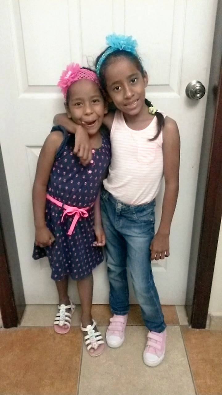 Kira (left) and her older sister.