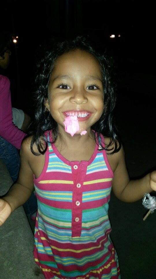 Kira* enjoying cotton candy and flashing her signature smile!