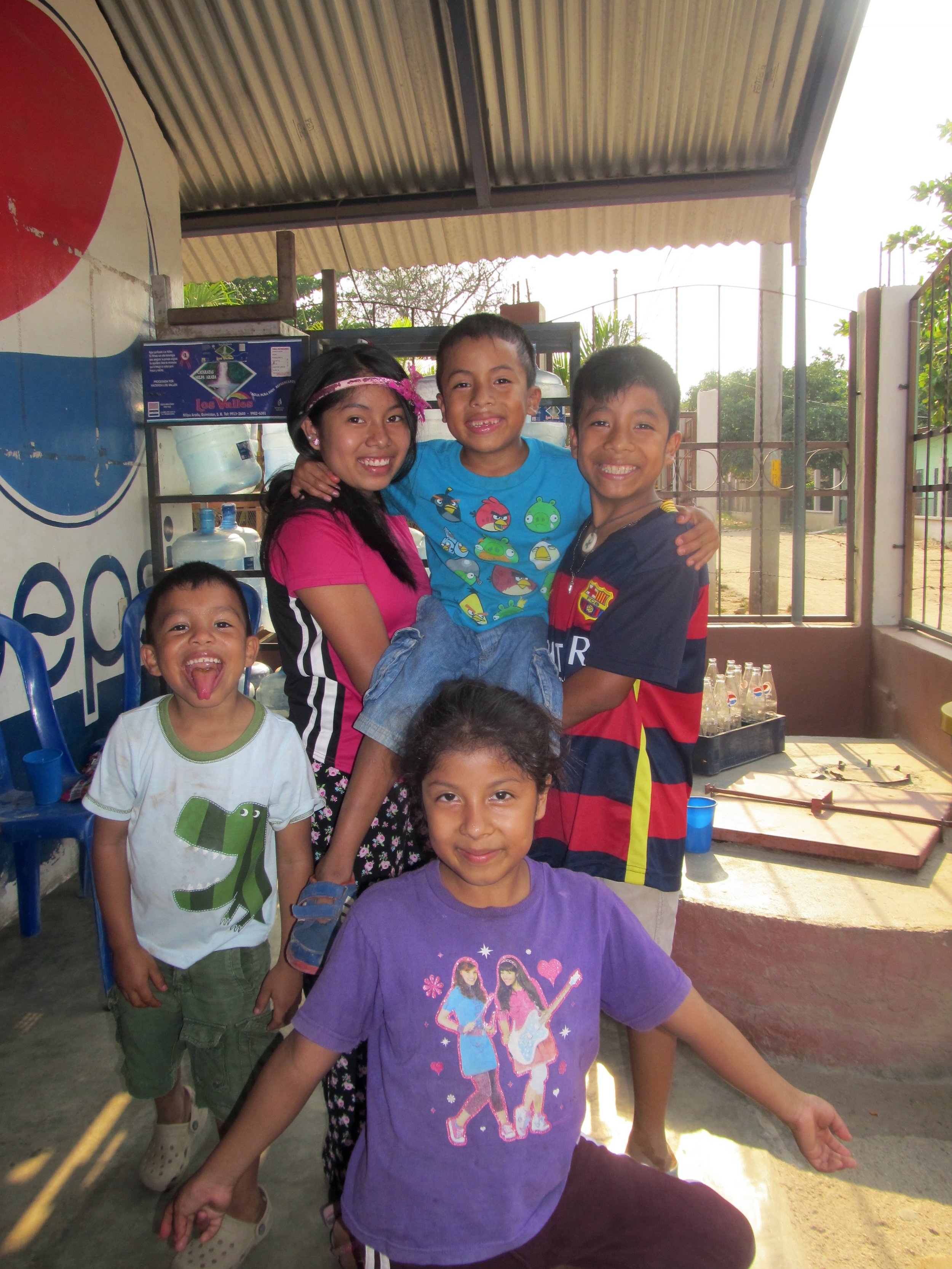 Herndando (upper right) with his three siblings and a friend (white and green dinosaur shirt)