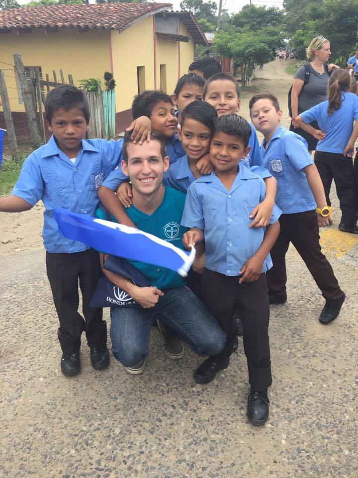 Claudio* (front right) with Mr. Sean and friends at the local parade for Honduran Independence Day.