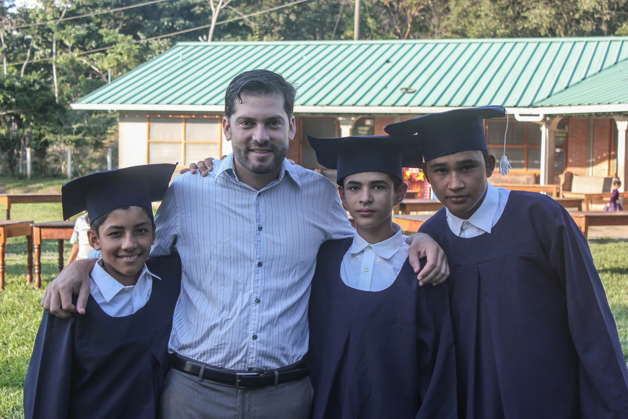 Adán (right) with Pato and his fellow classmates at his 6th grade graduation in December 2016