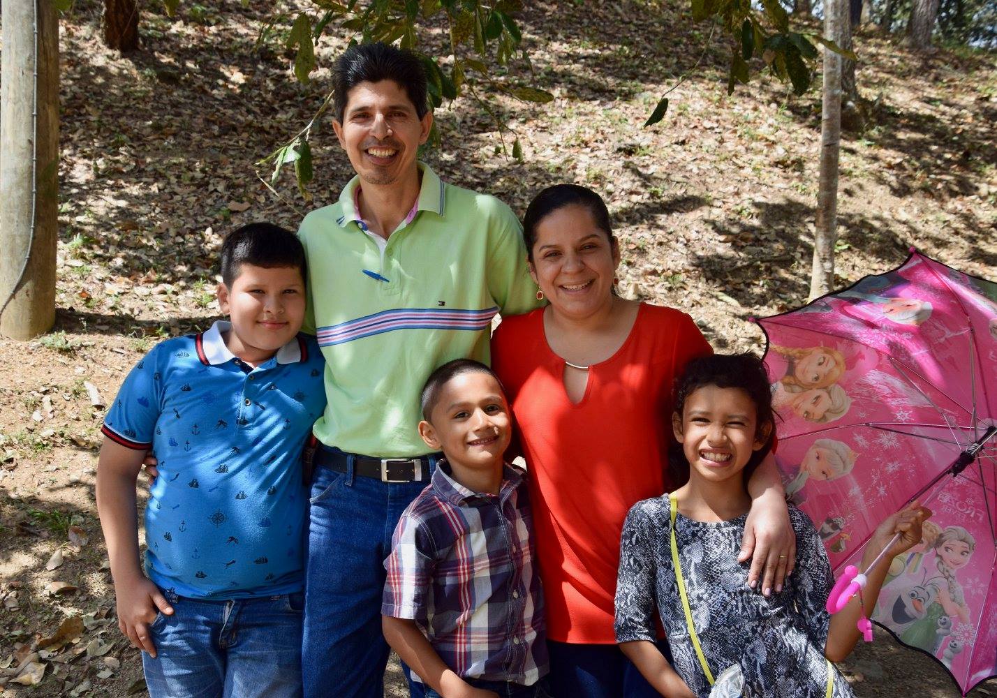 Felipa (right) and her brother (center) with a neighborhood family from the Amigos School, who has taken the two under their wing, visiting them every year on Visitors Day and sometimes even inviting them to their house on weekends.