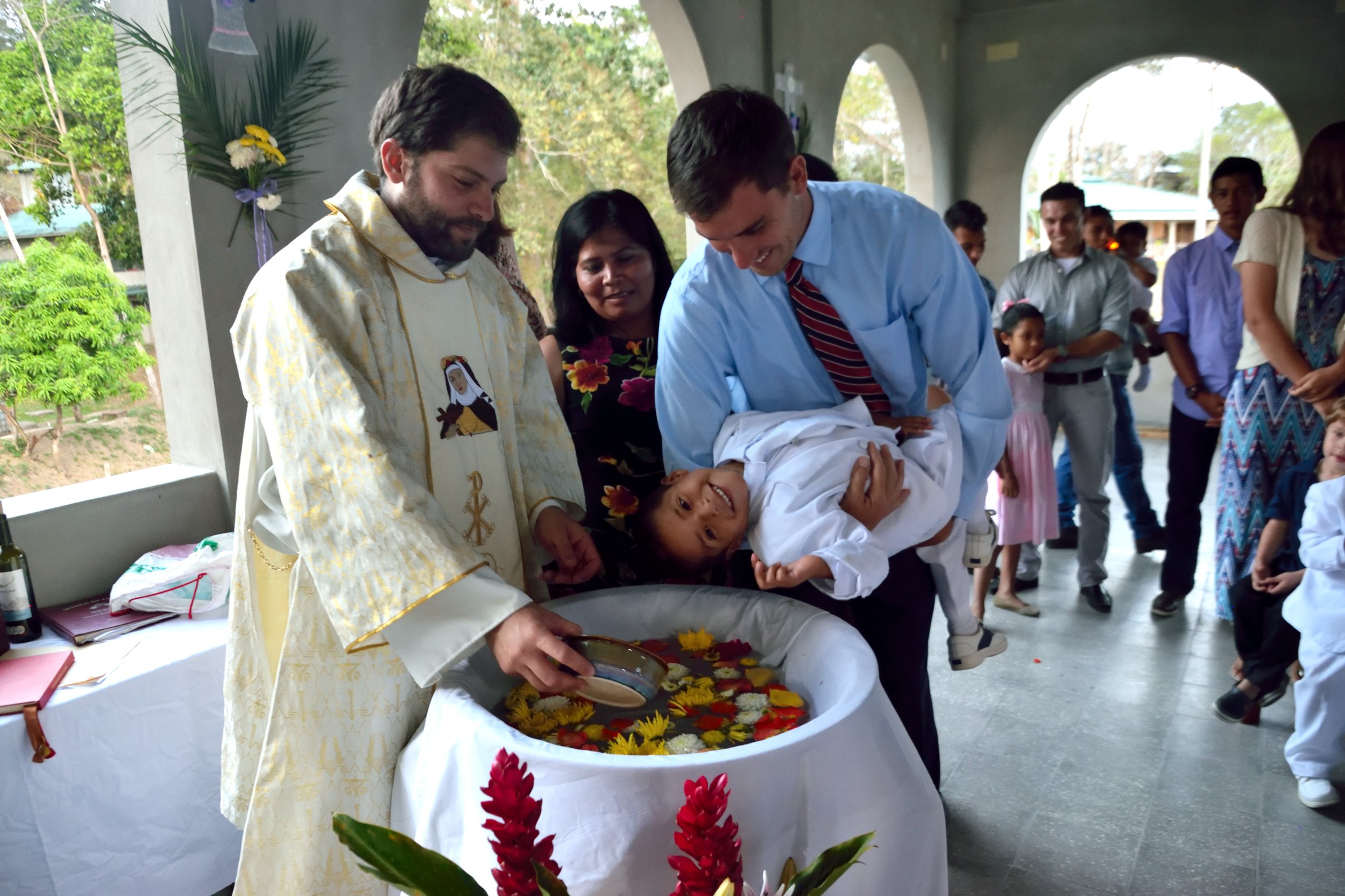 Alan with his godchild, one of our newest children, at the Easter mass in April 2017.