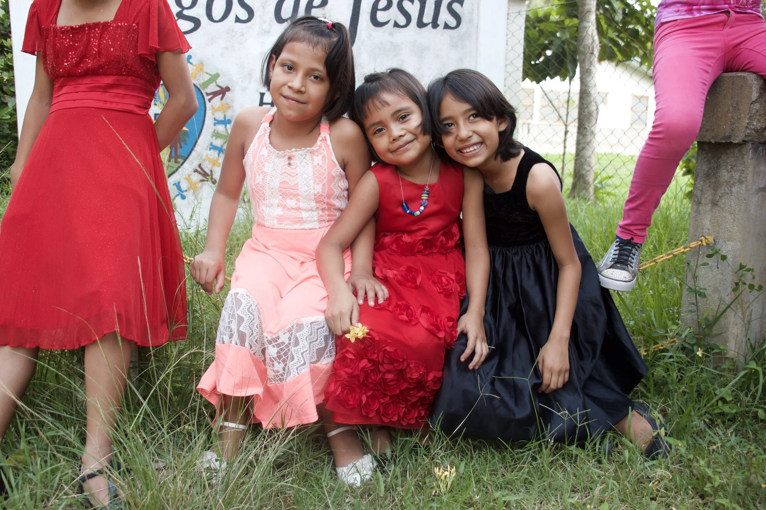 Perla (in the black dress on the right) with two of the other girls in her dorm.